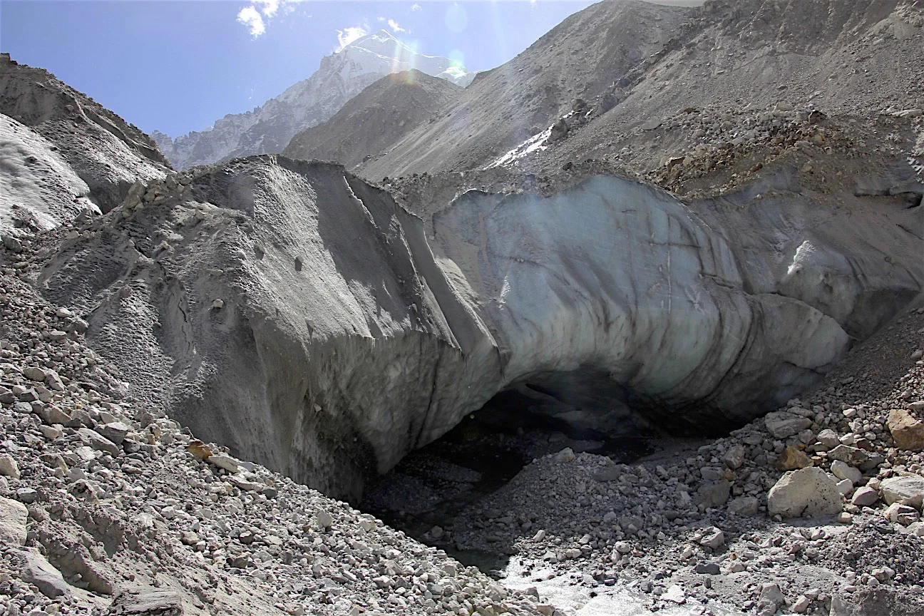 The snout of the Langshisa Glacier with an impressive ice cave. Neither David nor Shyam were keen to explore the inside of it!