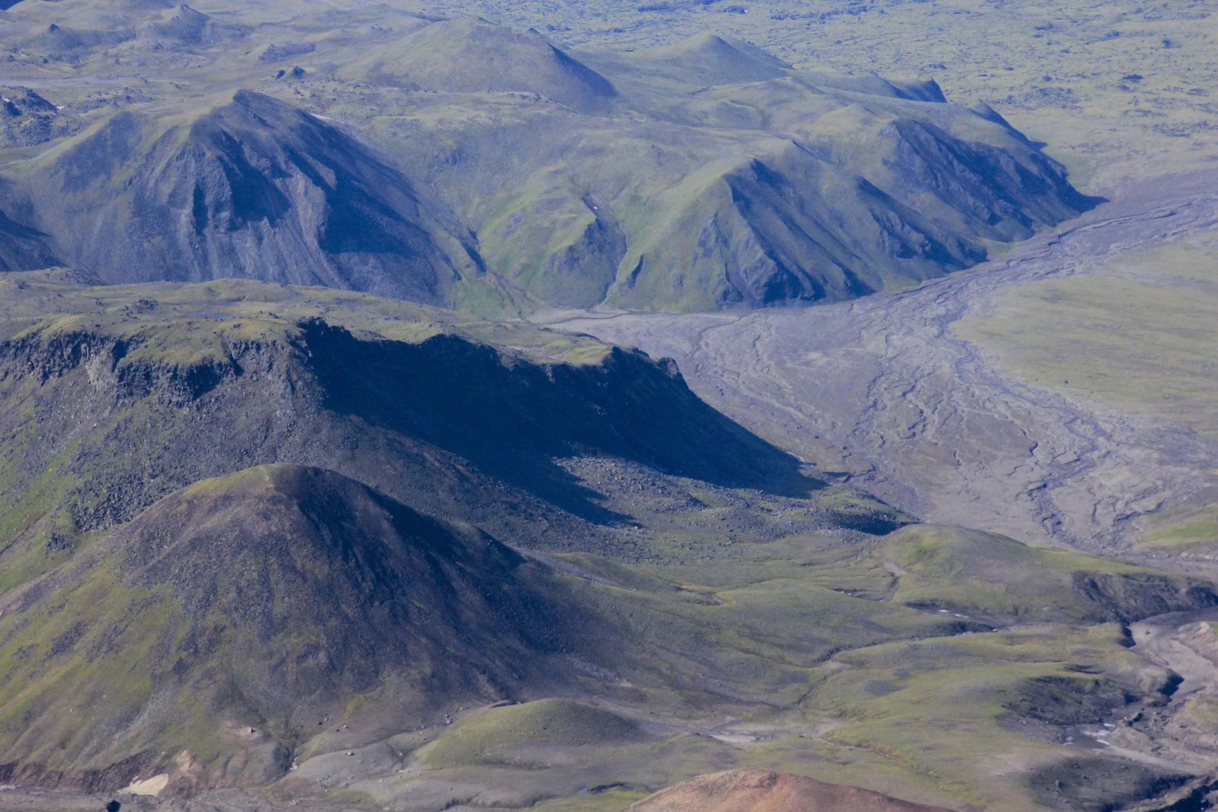 The old volcanic craters seen from the top of Bezimienny and the view of the small pass we had to cross the day before.