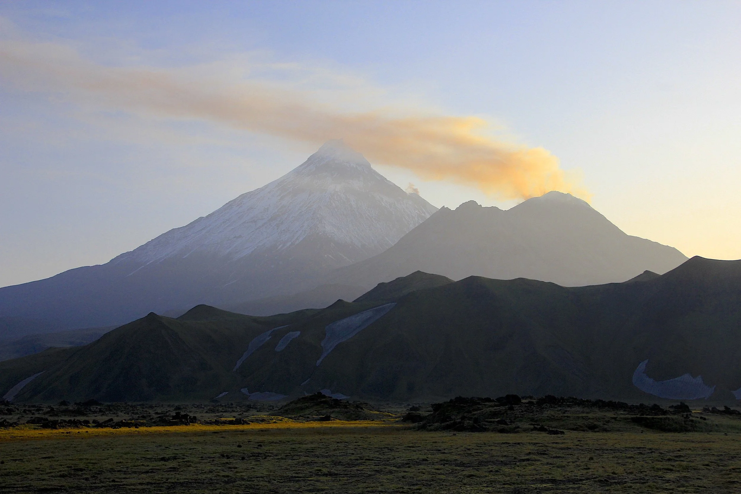 The view of the volcanic ash cloud from the crater of Bezimienny at sunrise.