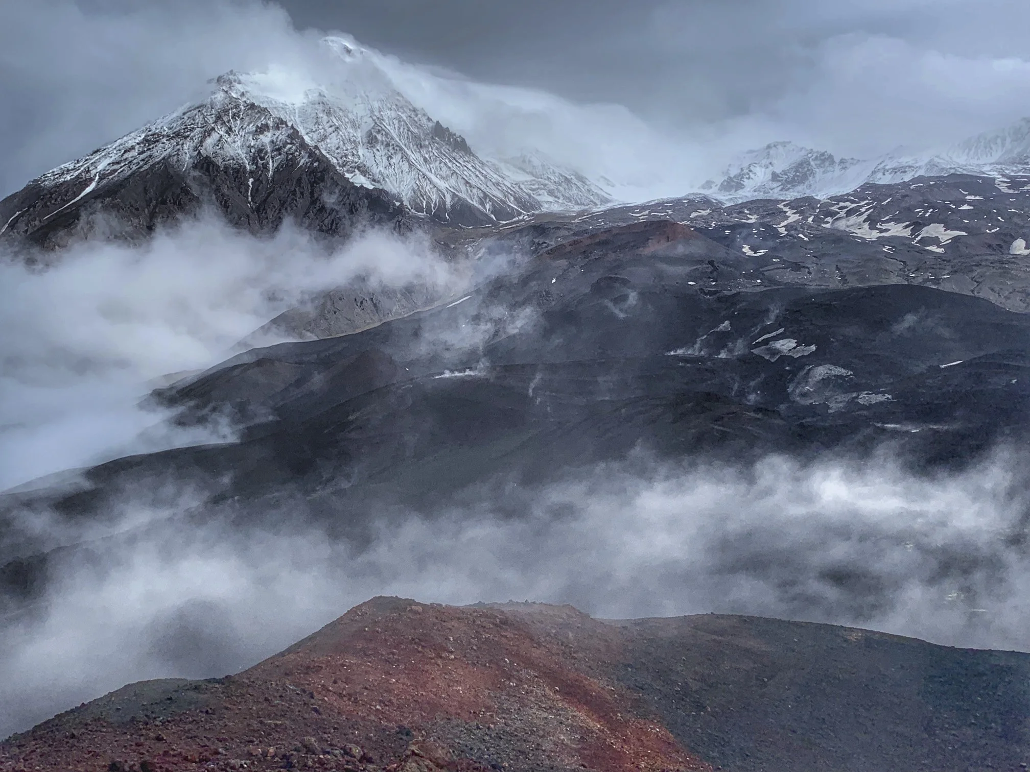 The slopes of the Tolbachik Volcano obscured by the clouds. Poor weather and lack of visibility prevented us from going to the top although it was our plan.