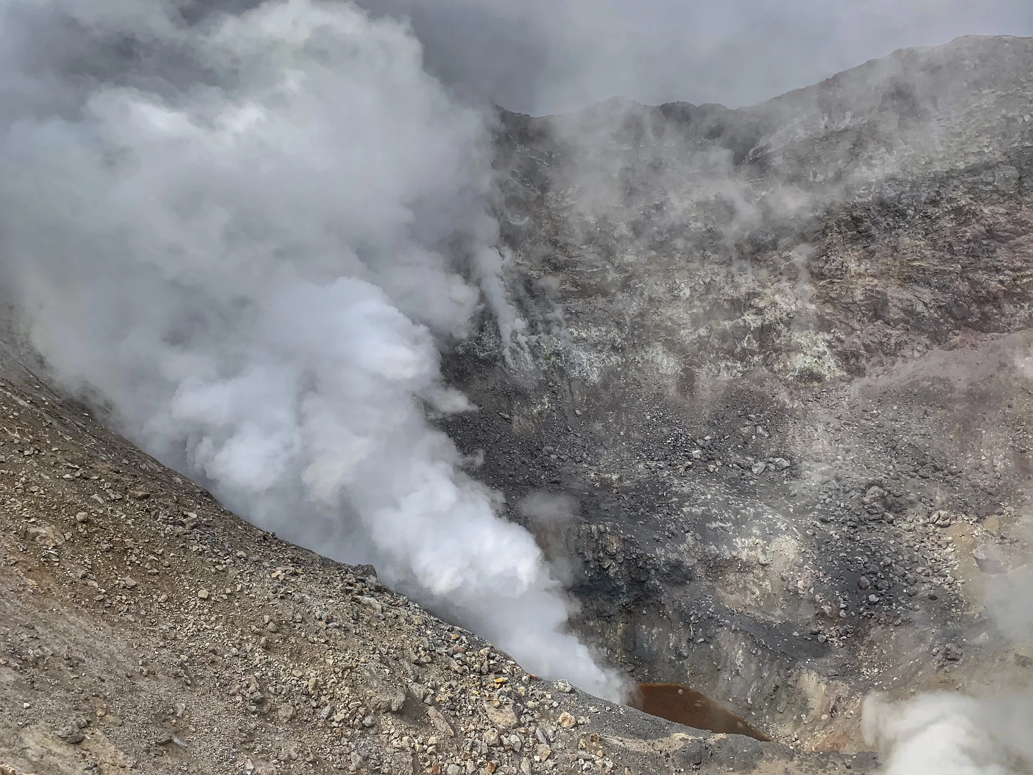 At the bottom of the 150 deep crater, there is a red lake.