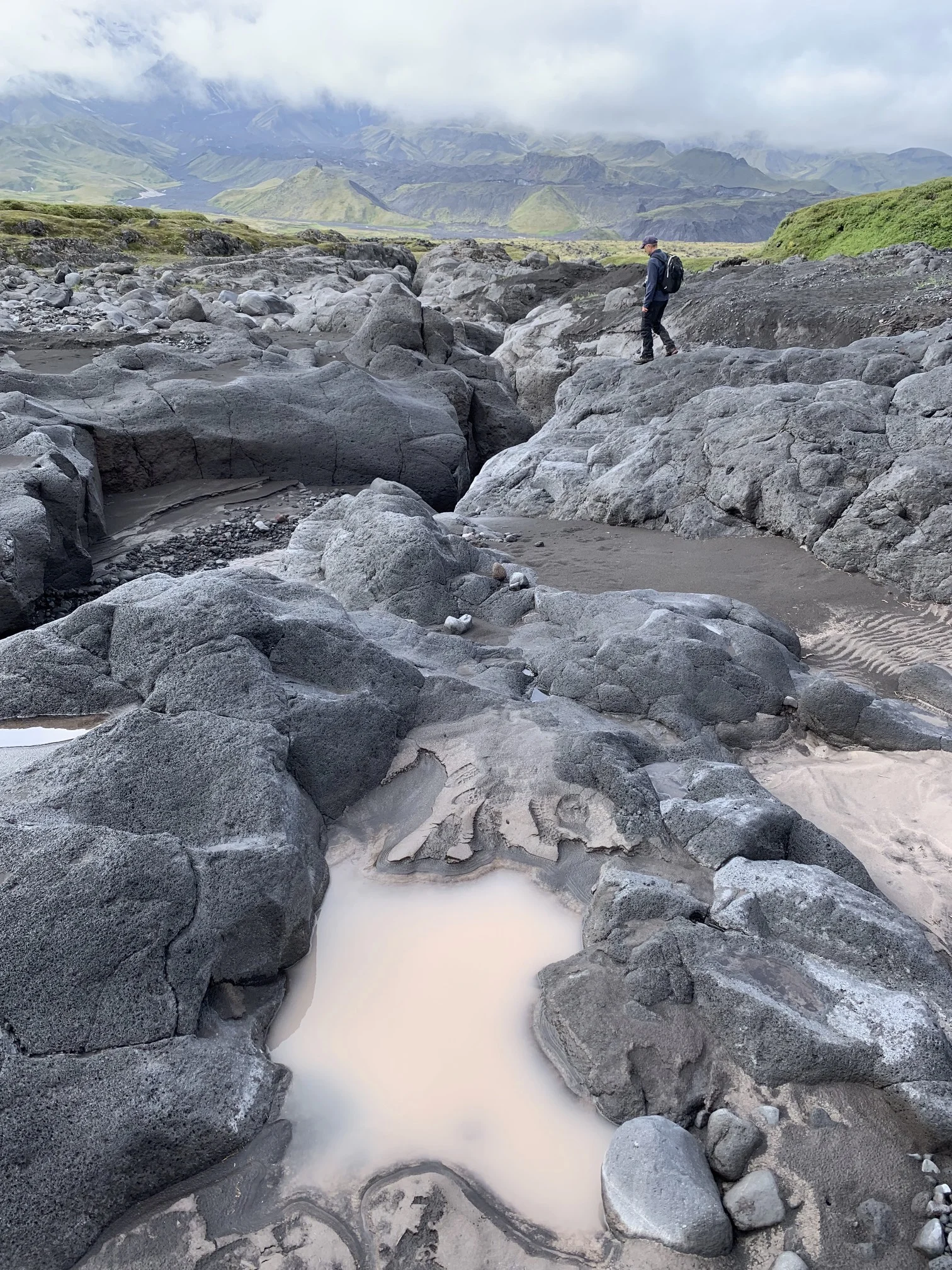 The water made these deep channels and caverns in the soft volcanic rock. There is a narrow slot canyon that one can walk trough during the dry periods.