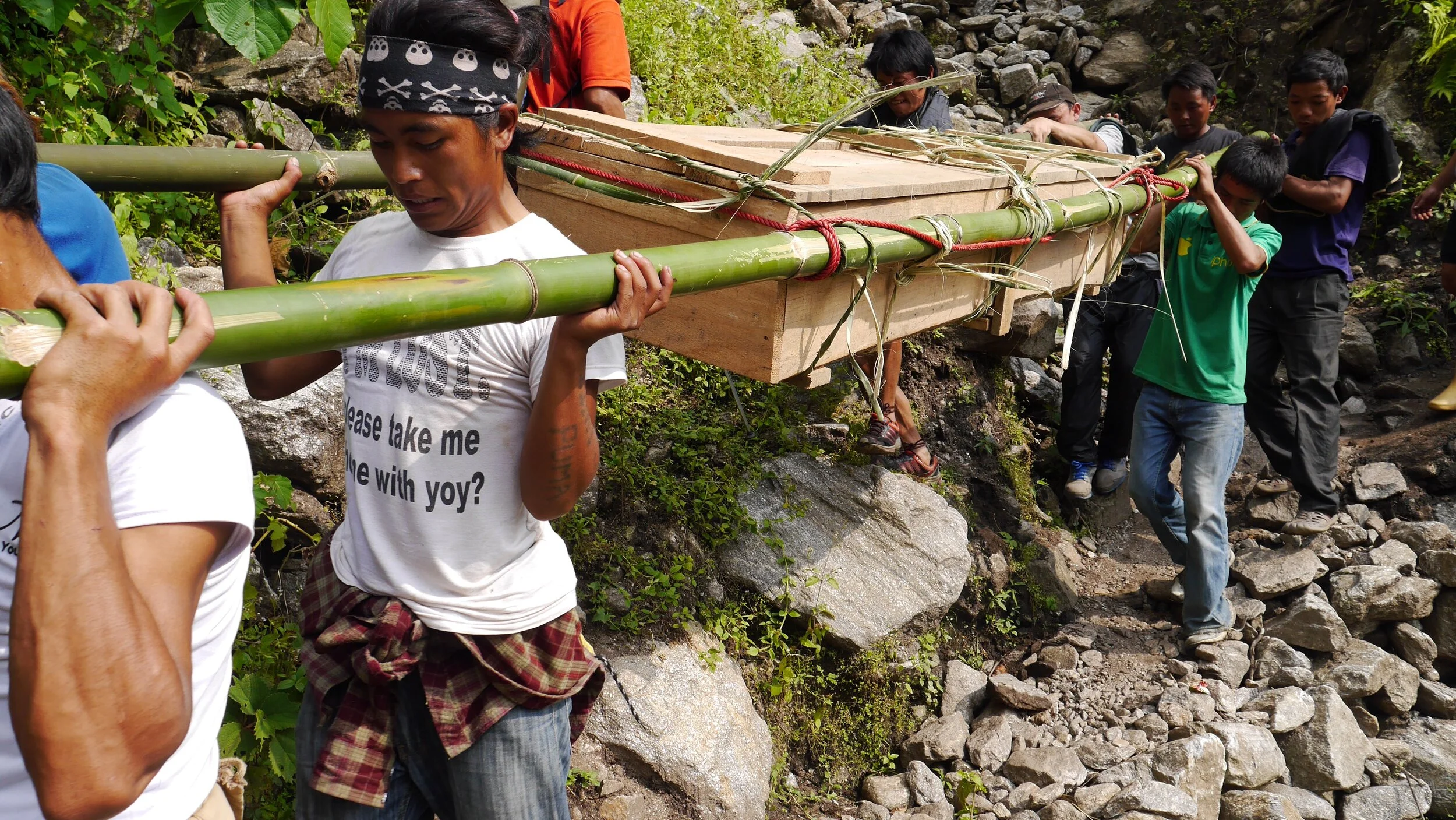 Taking the dead back home for cremation - on the trail in the Kangchendzonga region in Eastern Nepal.