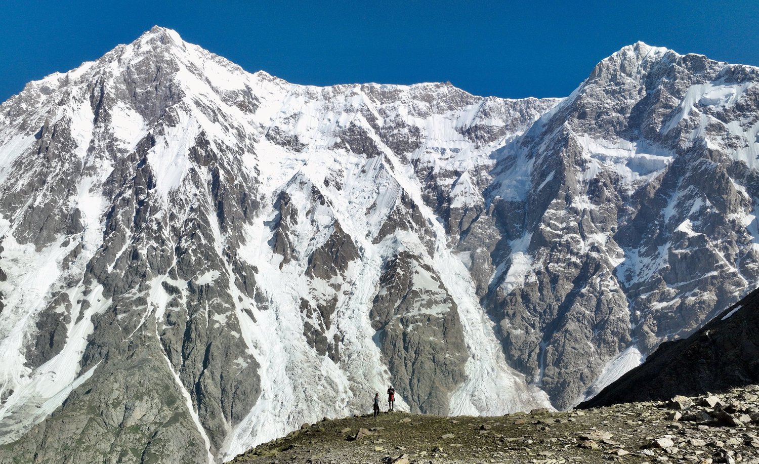 Man or trail on a ridge focusing on the path ahead