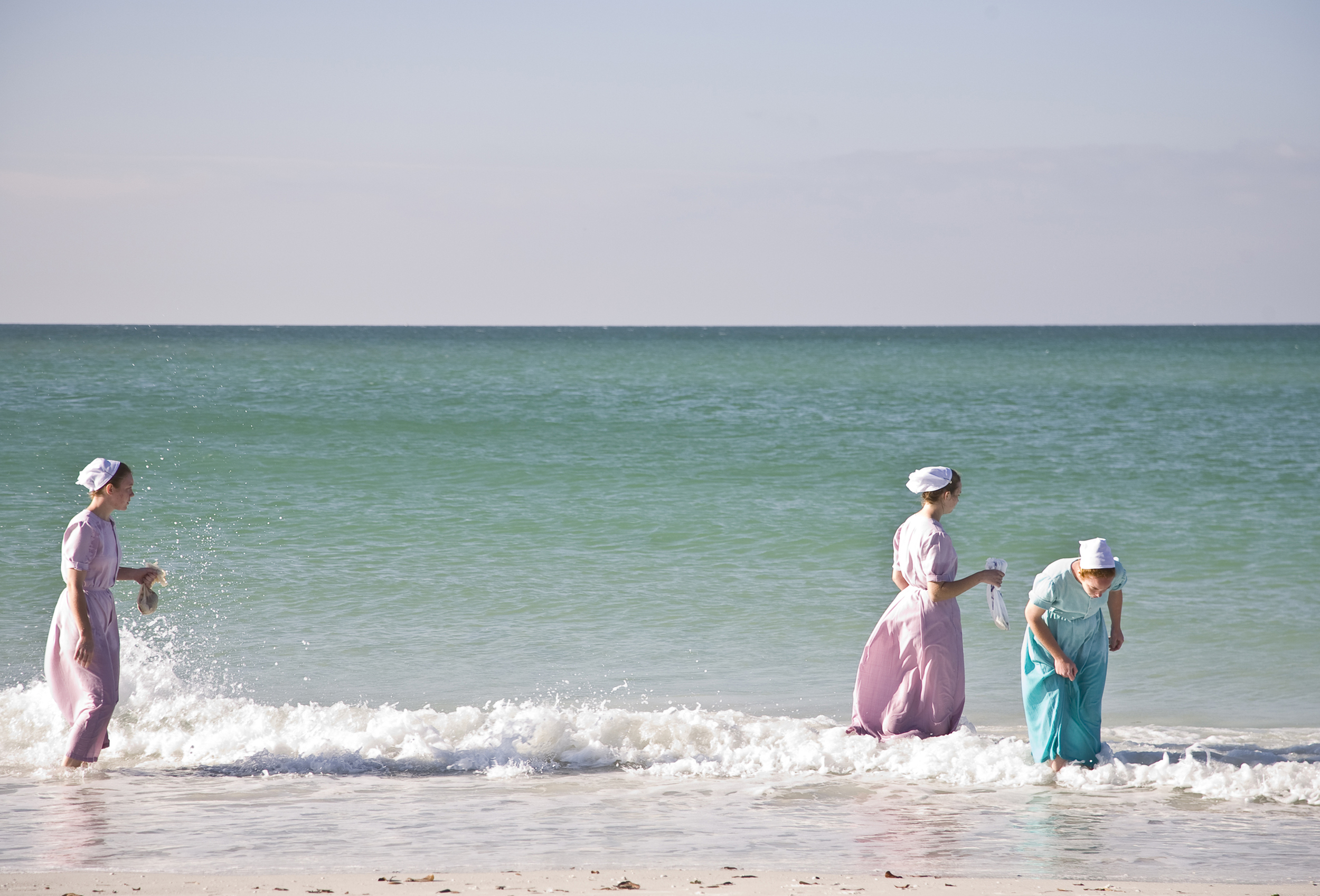 Mennonite ladies collecting shells.
