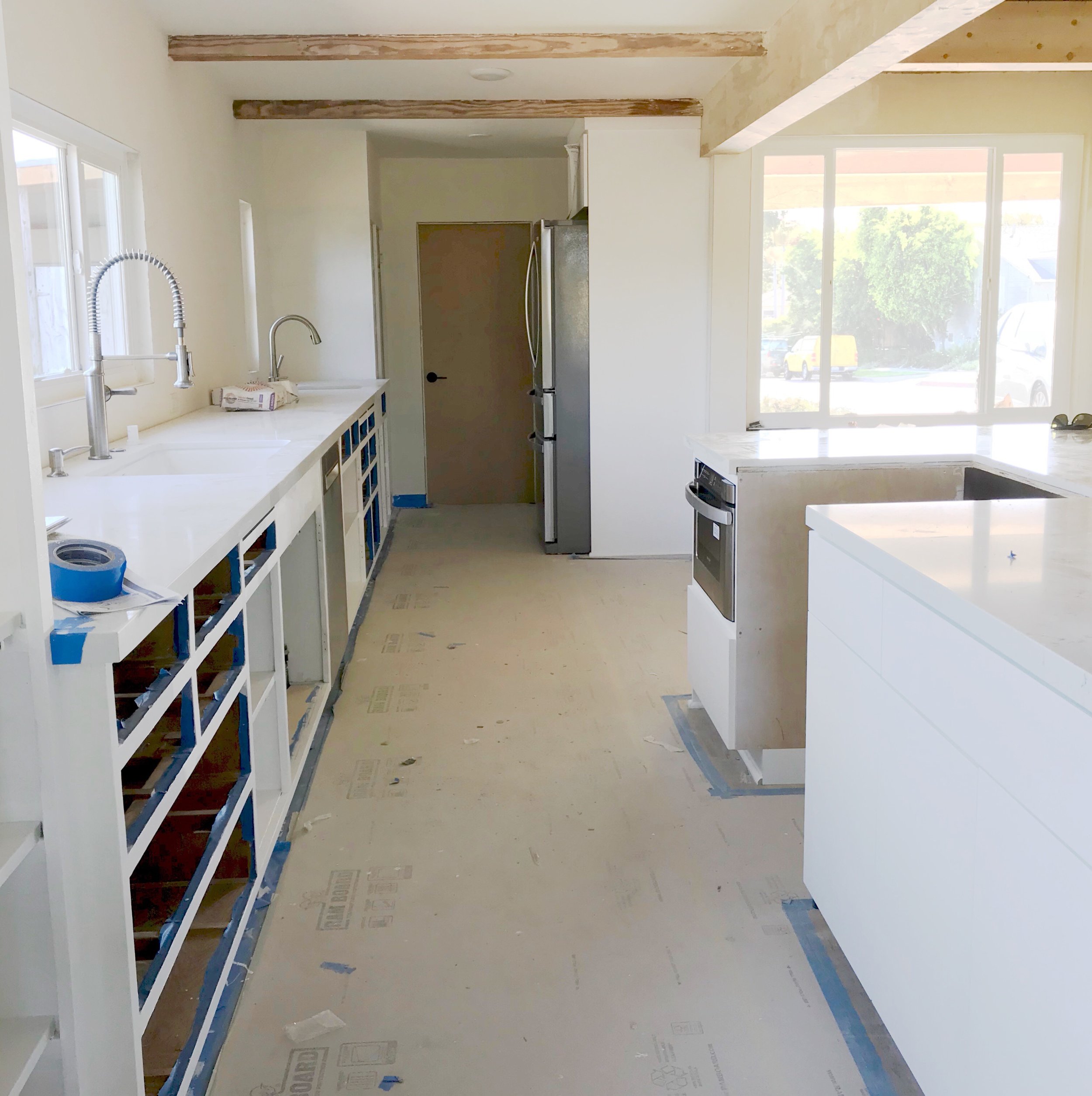 Painting the First Coat on the Cabinets