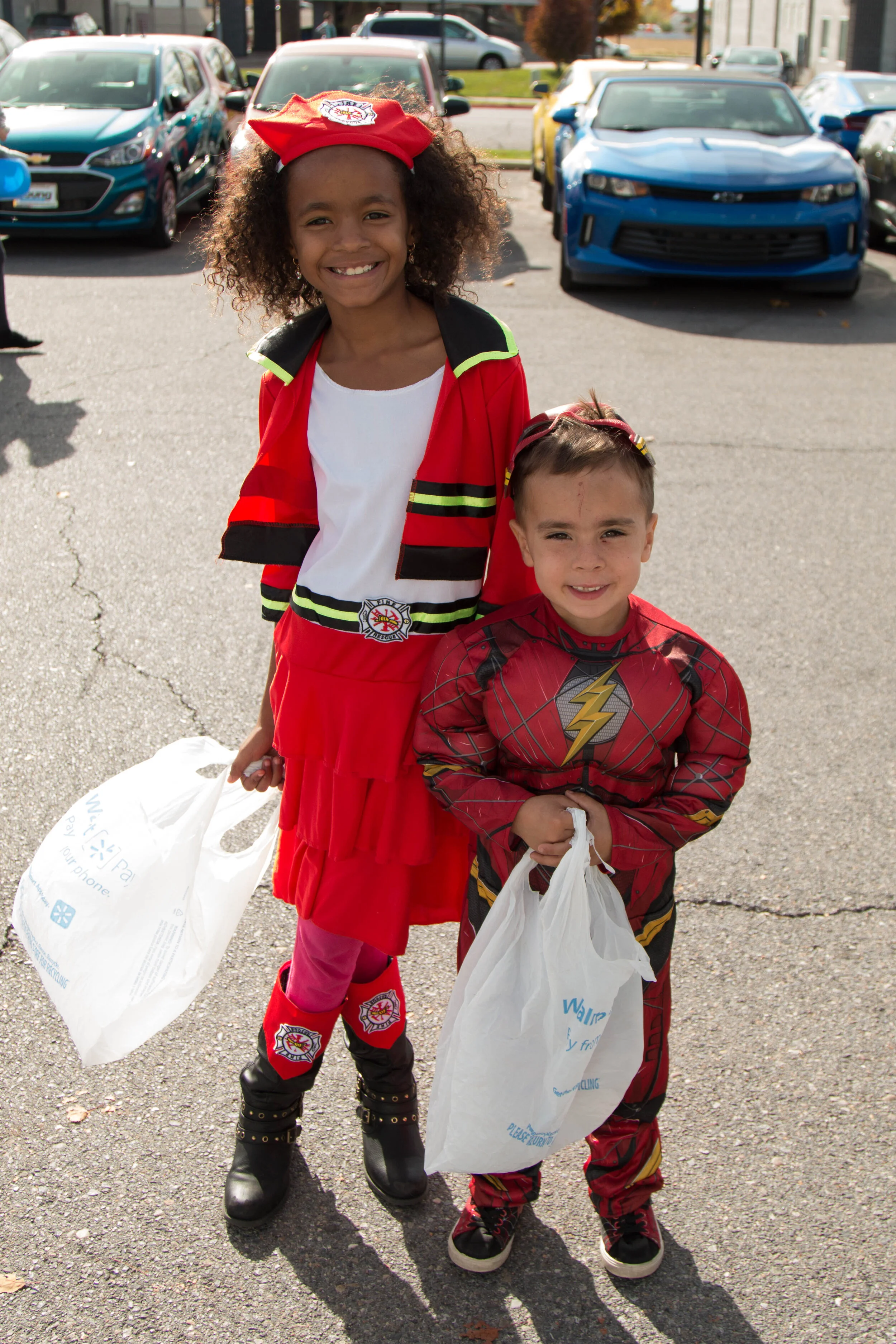 Siblings show off their costumes at Trunk-or-Treat.
