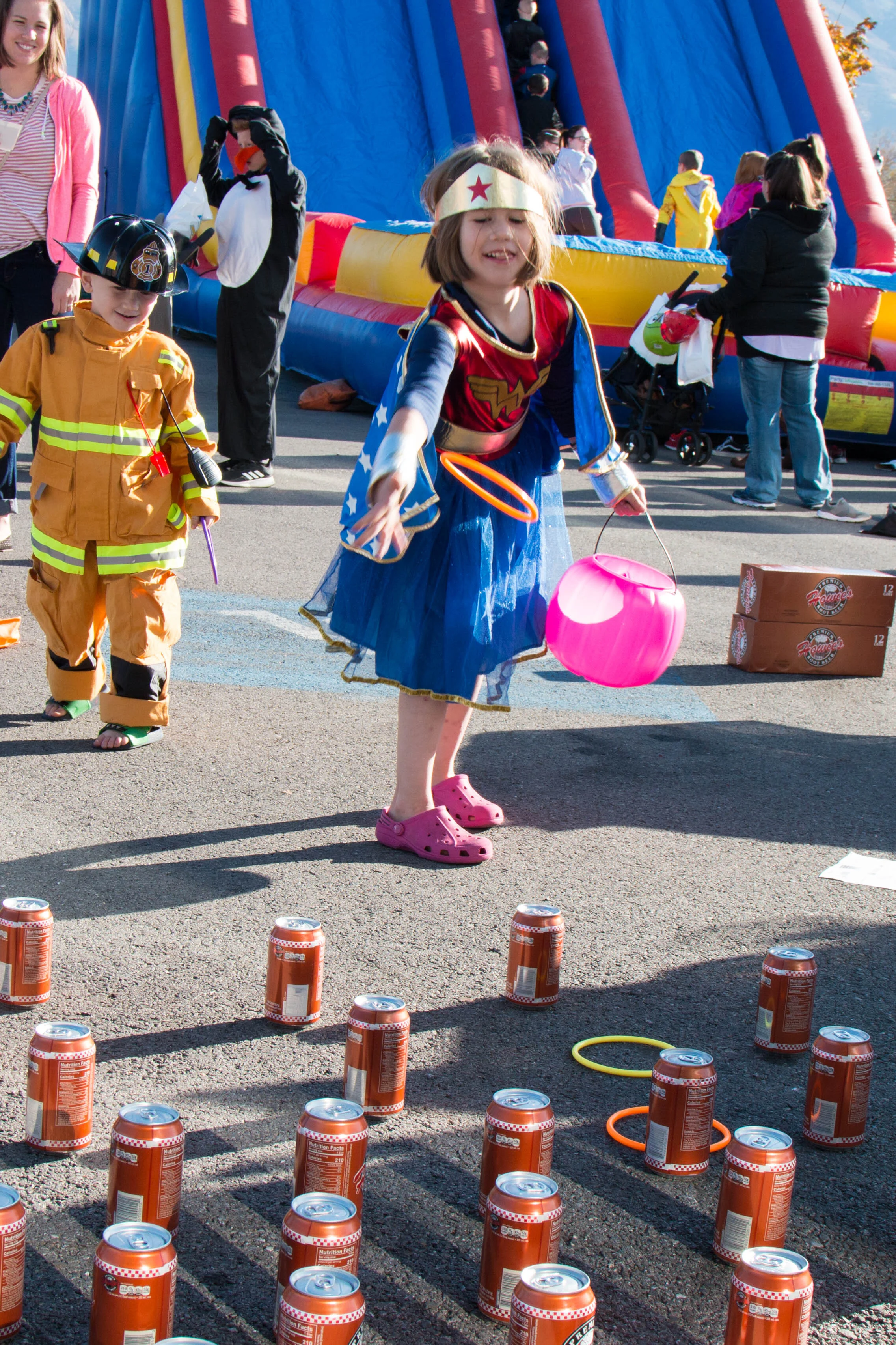 A child enjoys the ringtoss at Young Automotive's Trunk-or-Treat.