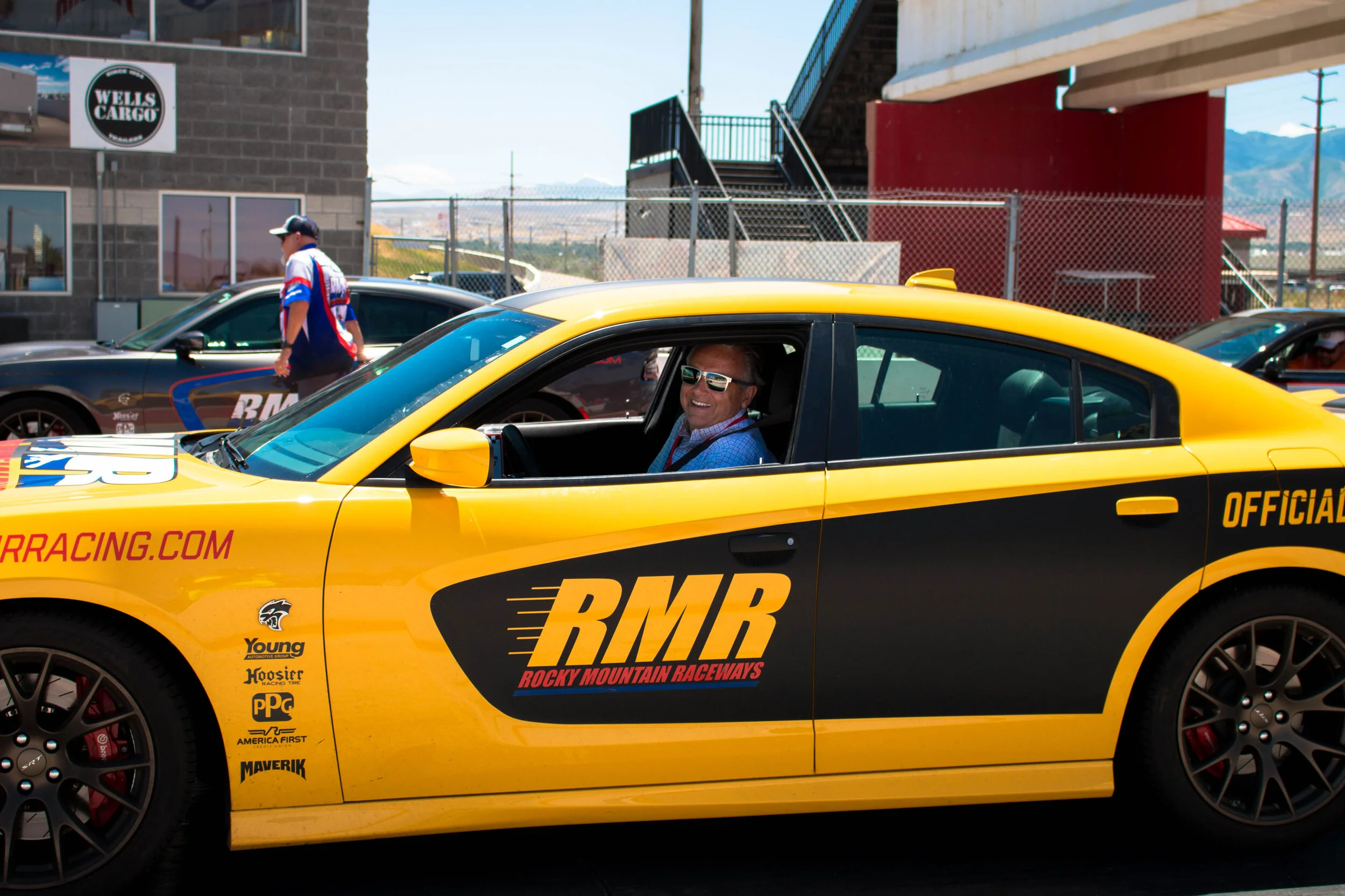 A driver smiles after completing his race.