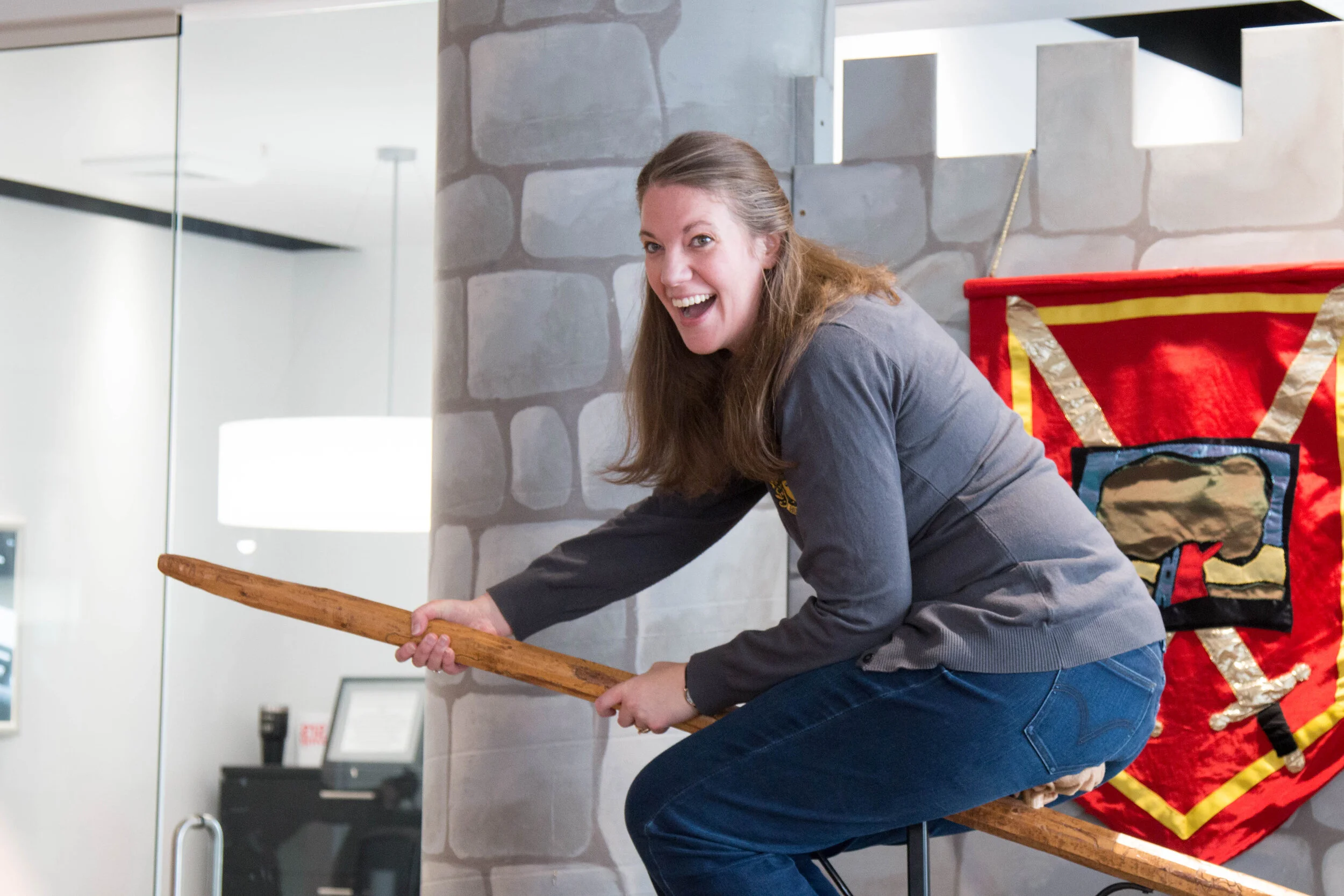A teacher tests her Quidditch skills at Spring into Literacy, an event to promote reading.