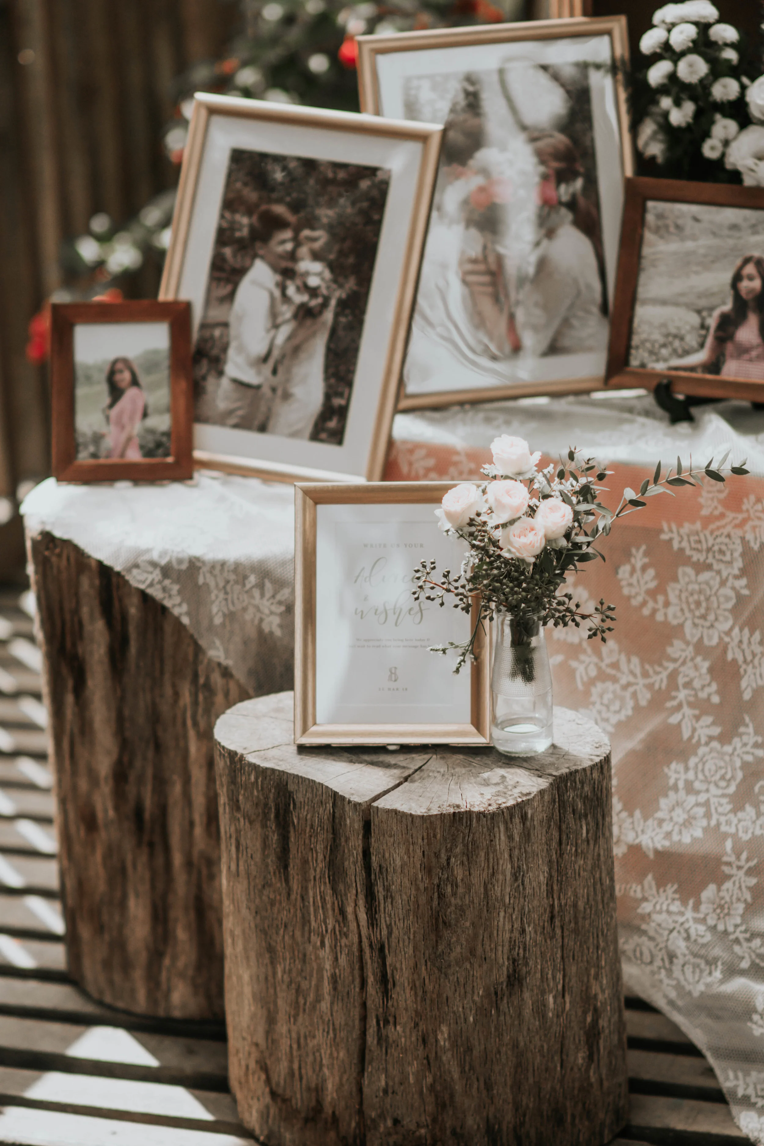 outdoor rustic wedding decoration with wood logs and flowers