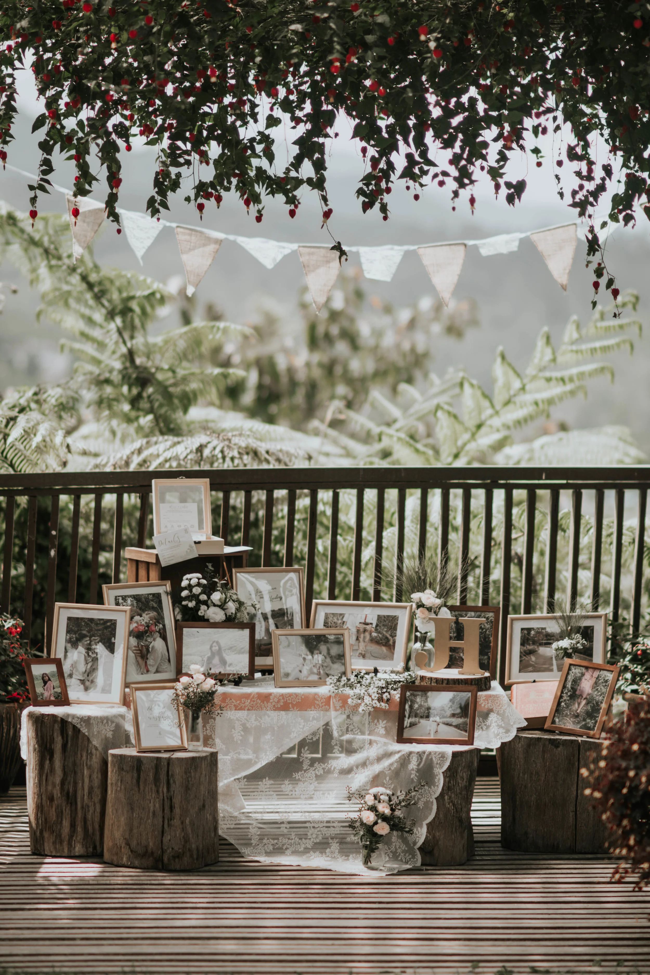 rustic style outdoor wedding decoration with flowers and photo frames
