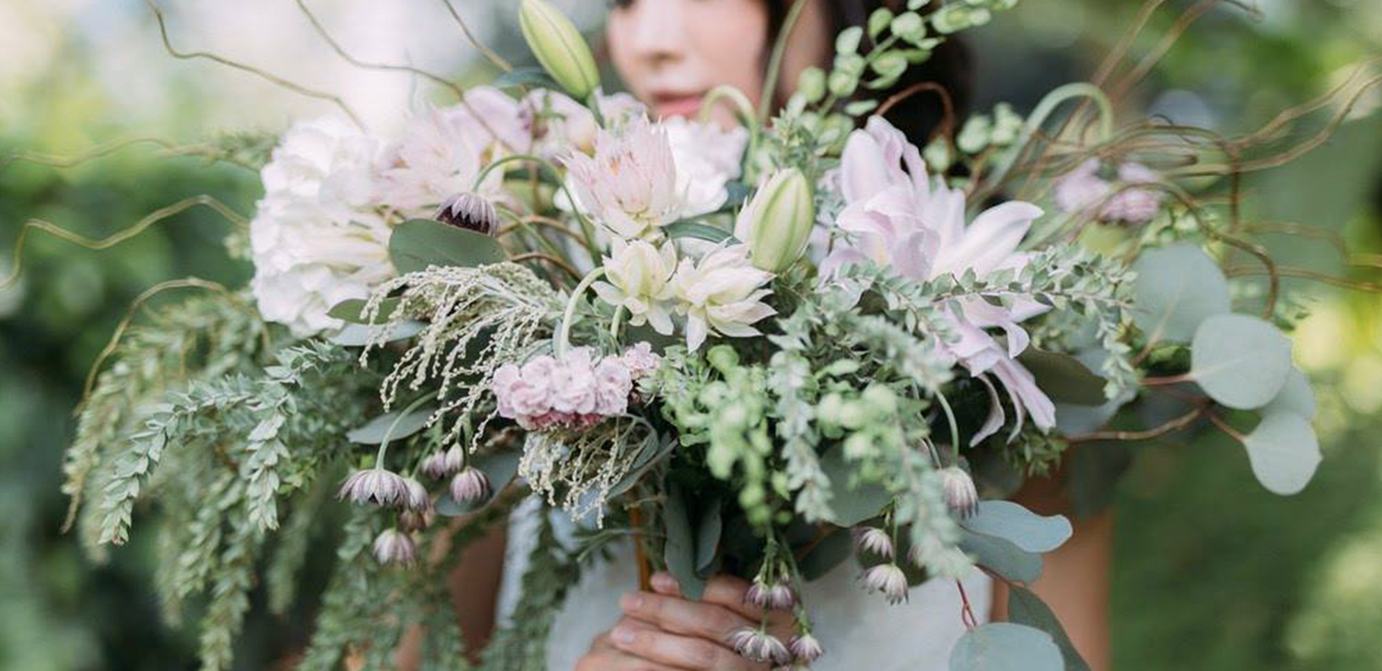 wedding huts bride holding cascading bridal bouquet flowers