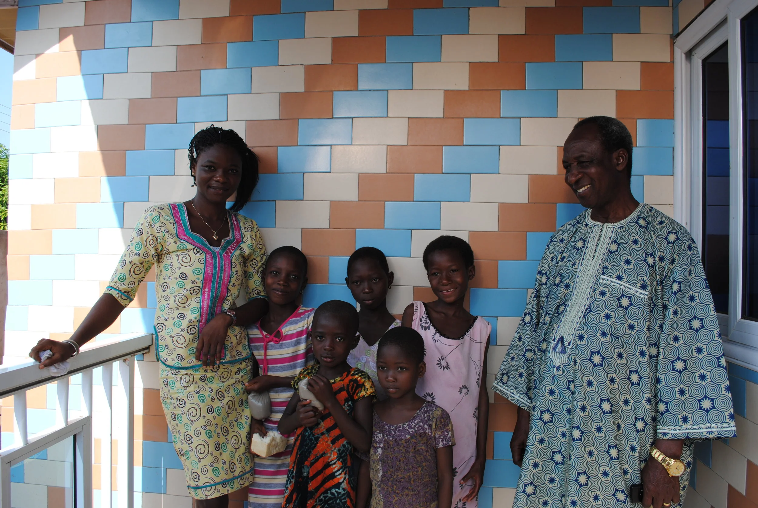I remember after taking several photos of the girls, Bernard said, “eh…shall we join them?” I’m so glad he asked! I also love, love, love that he and Mercy wore formal wear for the “rescue.” L-R: Mercy, Lucky, Sarah Jr., Dina, Gloria, God’s Way, and Bernard.