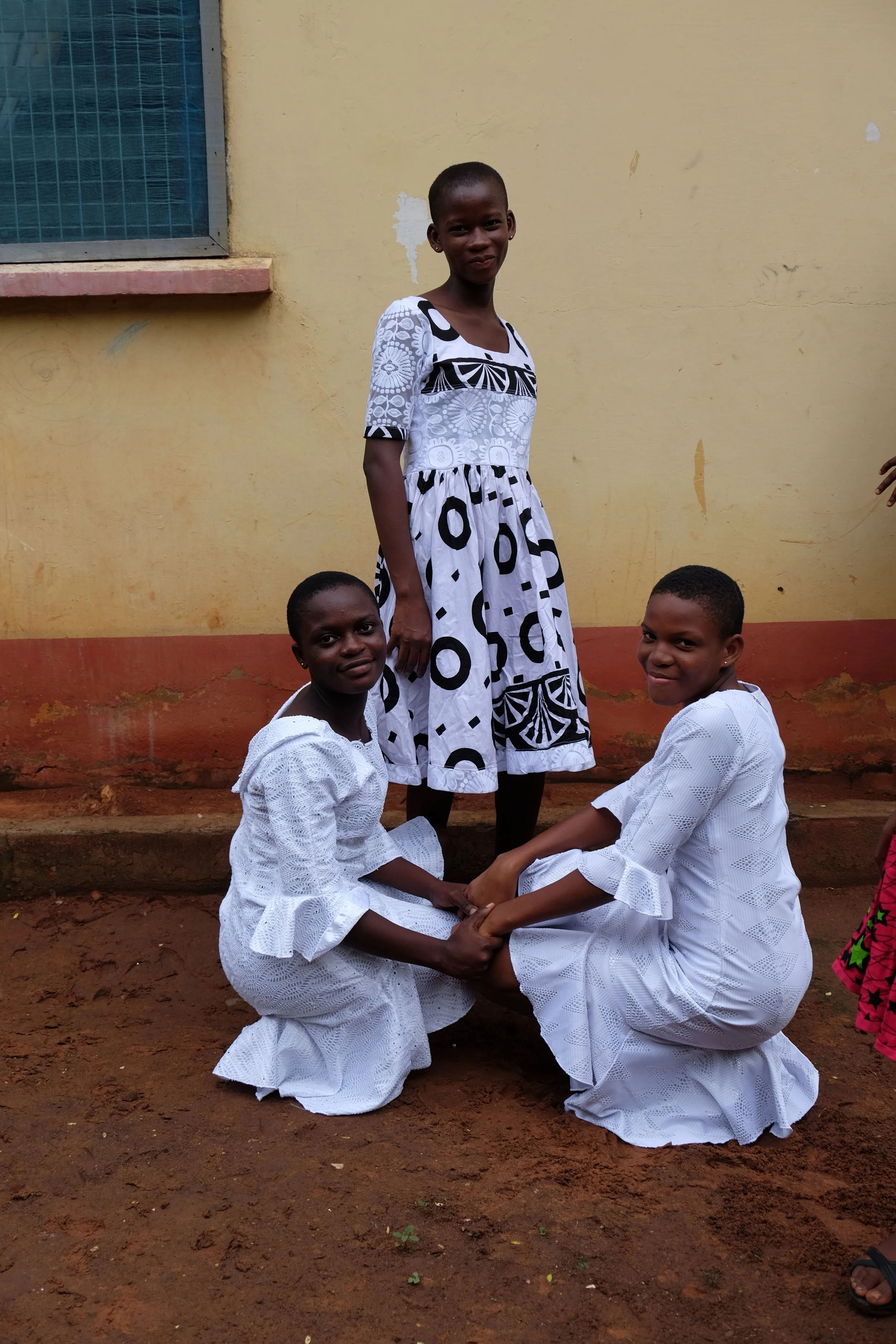 THEY LOVE THE HAND-HOLDING, KNEELING DOWN POSES! They orchestrate a picture like this on every trip.