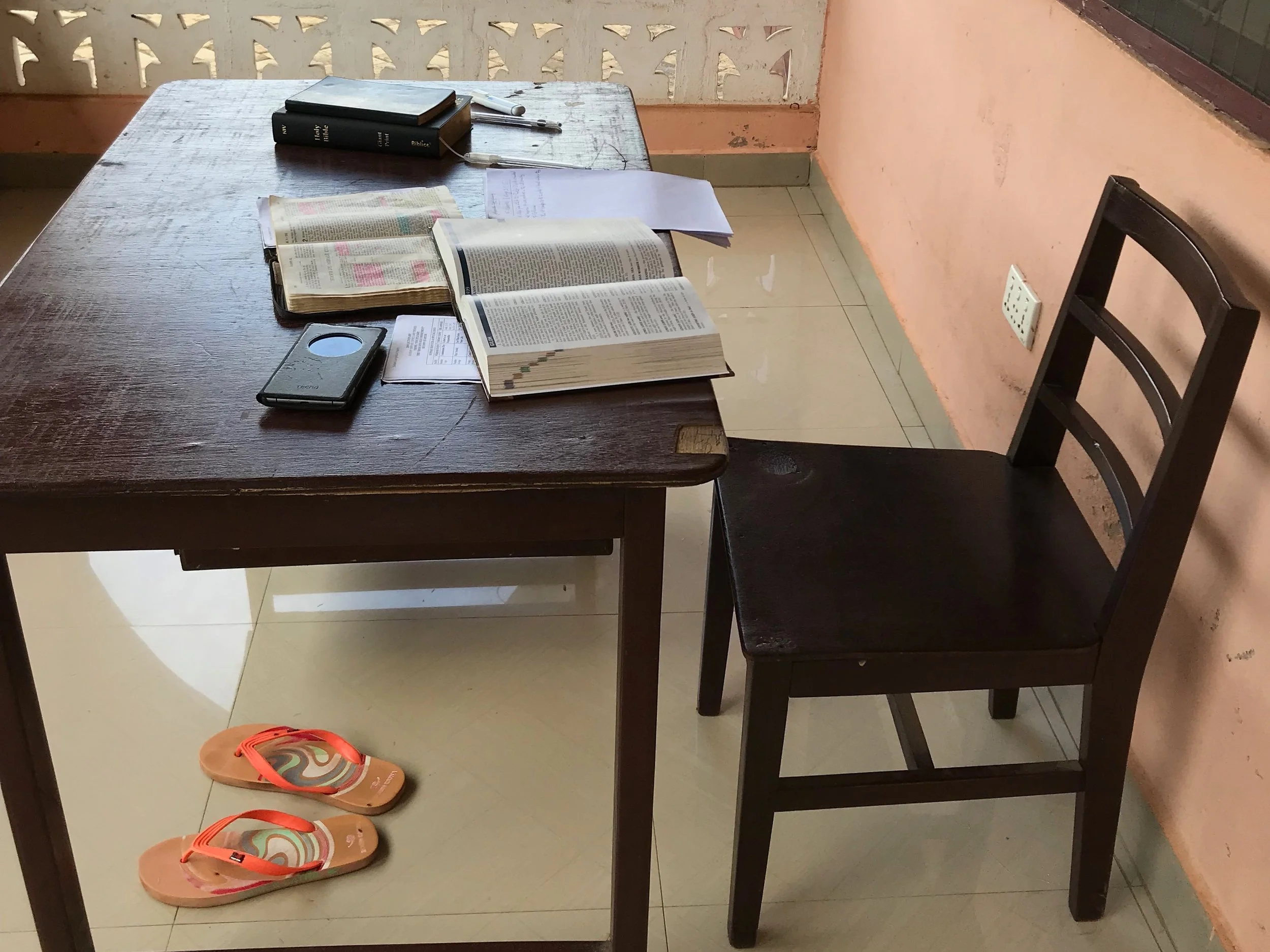 Our first stop in Akatsi was Bernard’s house. When we pulled up, he was outside reading his Bibles (an English and Ewe version) and taking notes.