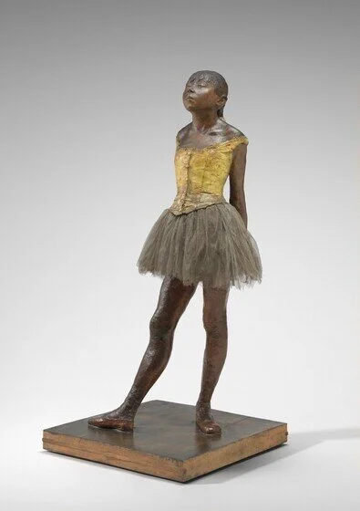 Little Dancer Aged Fourteen, 1878-1881, pigmented beeswax, clay, metal armature, rope, paintbrushes, human hair, silk and linen ribbon, cotton faille bodice, cotton and silk tutu, linen slippers, on wooden base, 39 in.Collection of Mr. and Mrs. Paul…