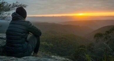 solitary-person-sitting-enjoying-sunrise-260nw-1689382153.jpg