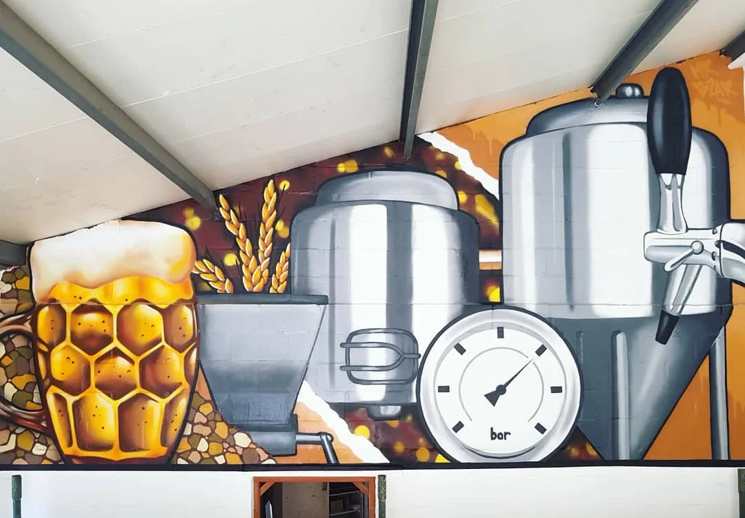 Brewing-themed graffiti feature wall mural painted by Mr Bzar at Valley Brewery taproom, Kommetjie, Cape Town