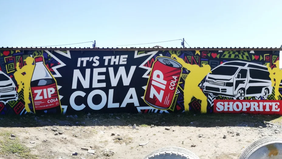 30 square metre ZIP Cola advertising mural painted by Mr Bzar and Jack De Jong in Nyanga, Cape Town