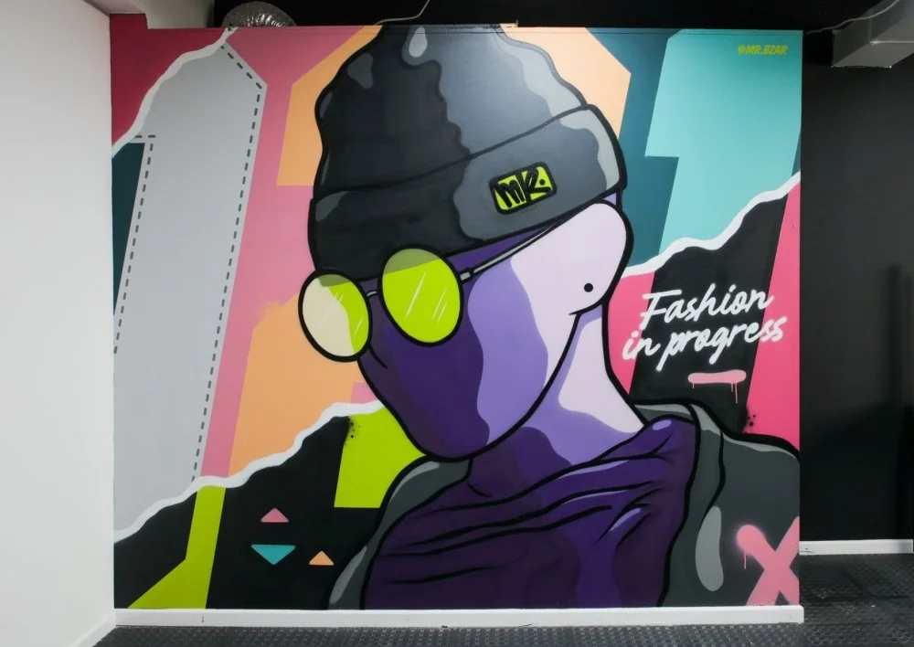 Colourful graffiti mural painted by local graffiti artist  Mr Bzar in FEDISA Fashion School tech labs, Cape Town campus