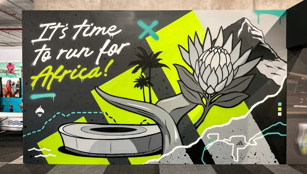 Adidas graffiti mural painted by Mr Bzar at the Sanlam Cape Town Marathon — featuring Cape Town landmarks and event slogan, Cape Town