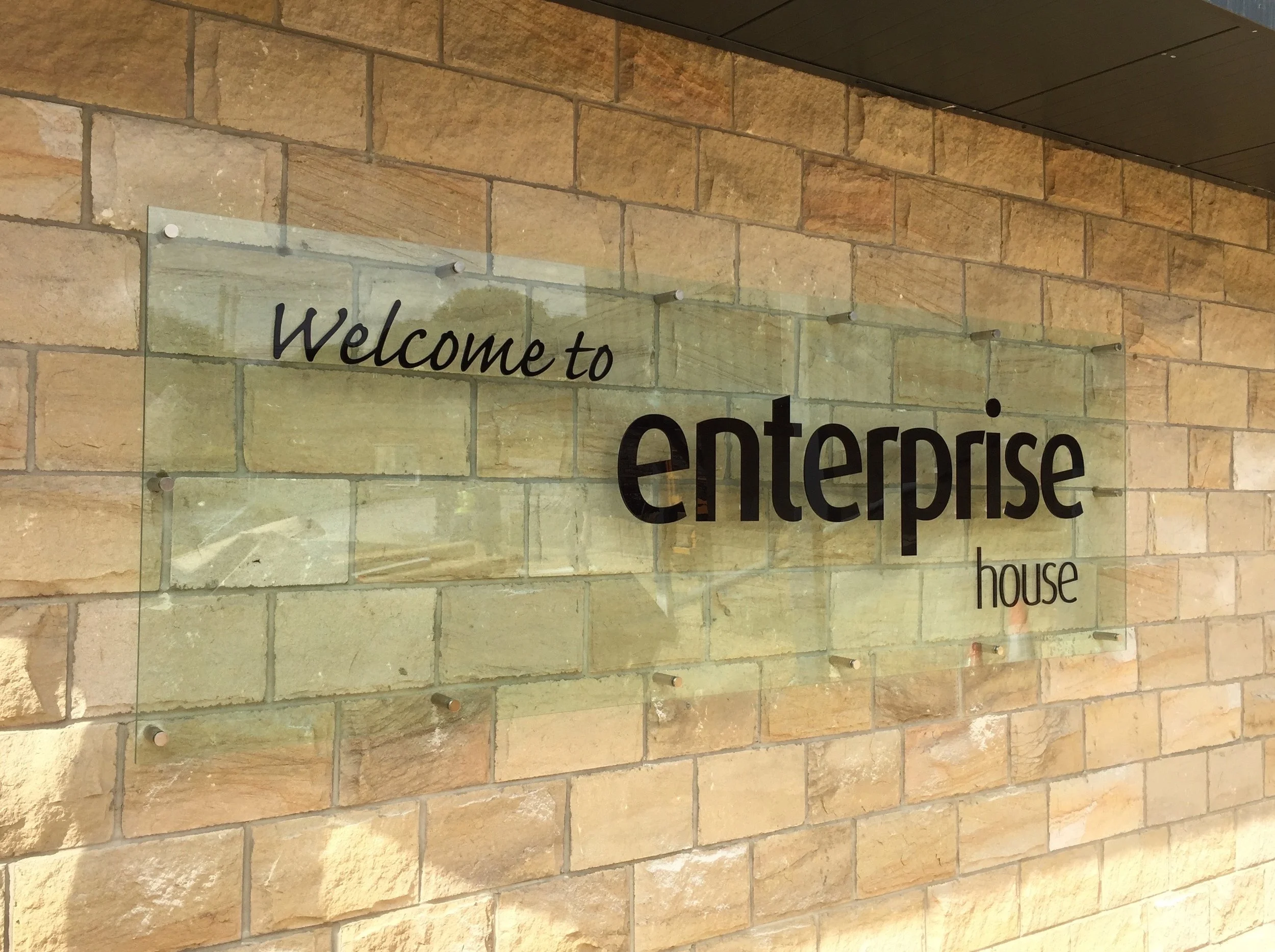 Toughened glass on stainless steel stand offs