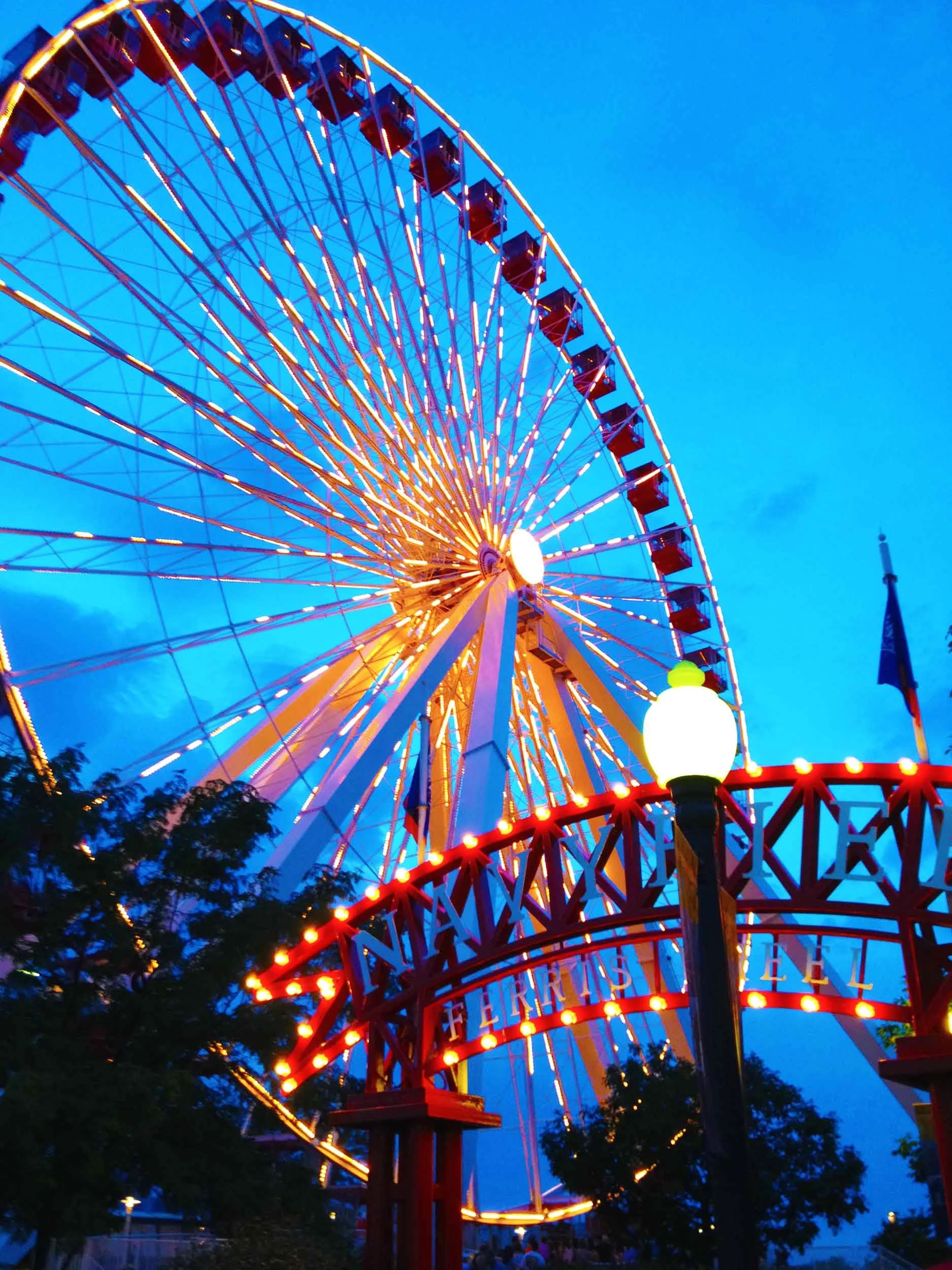 Looking up at the ferris wheel at Navy Pier in Chicago at dusk