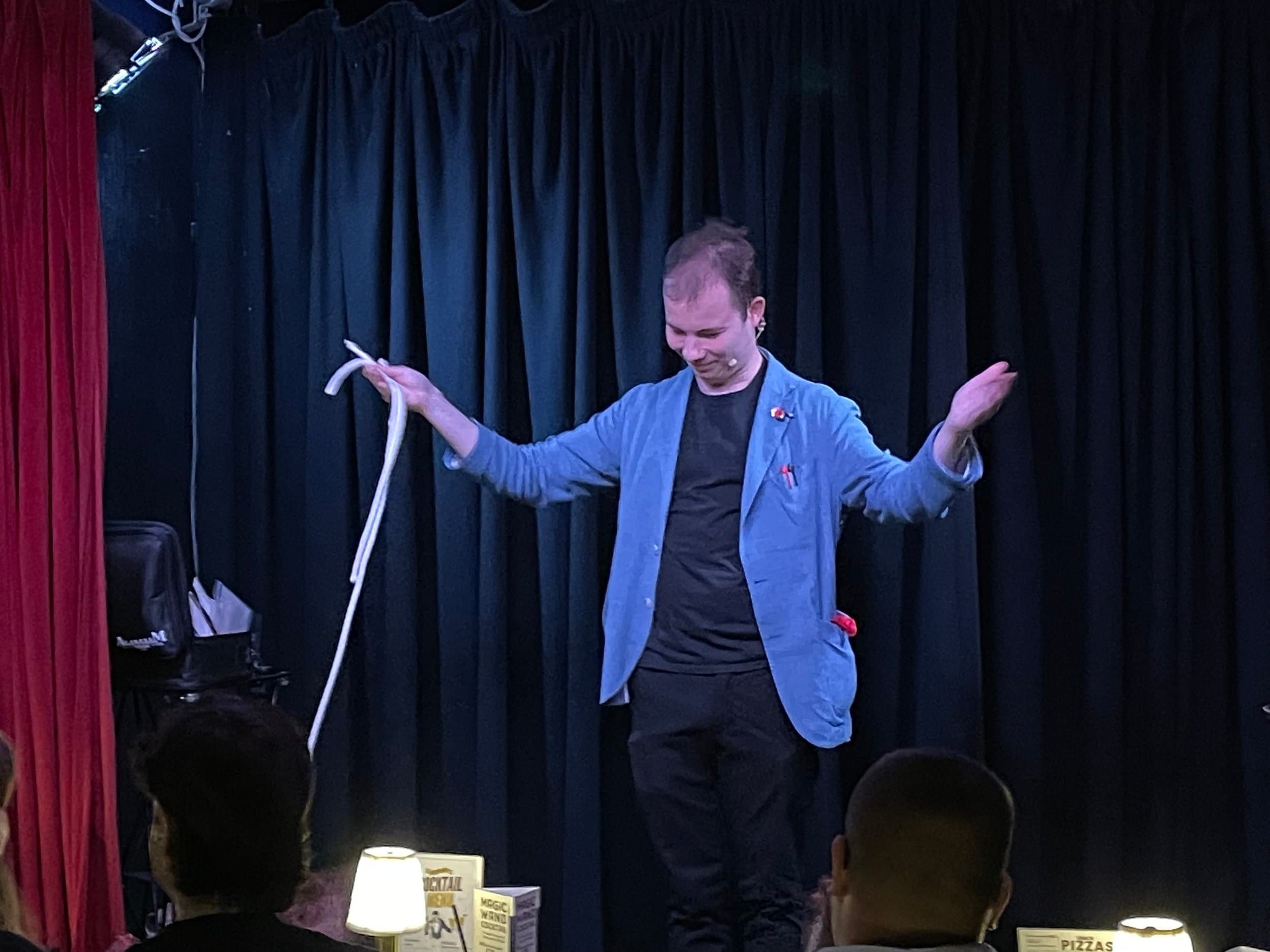 Jaie Taking a bow after finishing a a wonderful rope routine in his comedy magic show