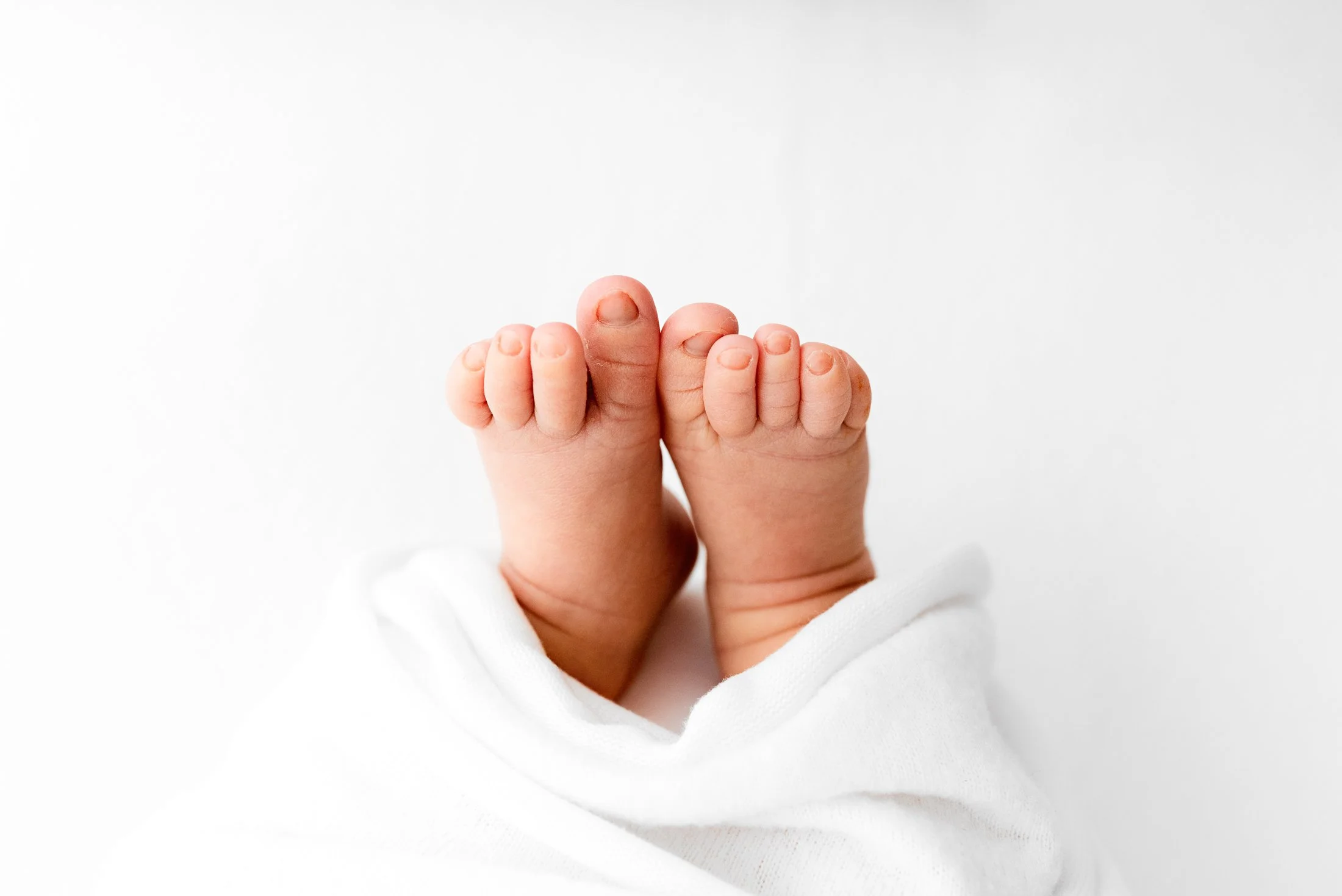 newborn photography reading close up baby hands natural studio session
