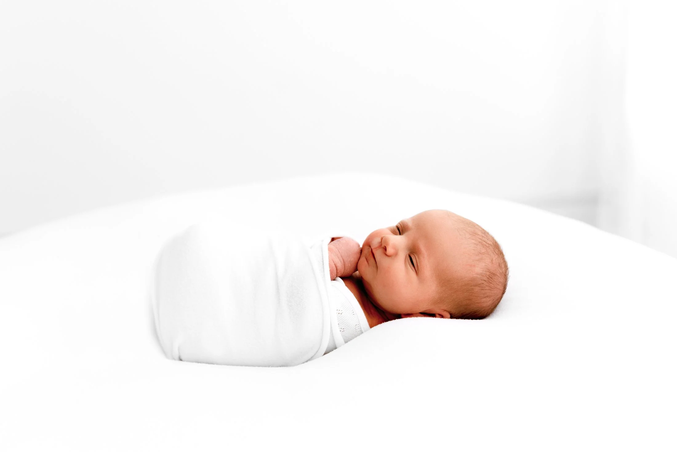 Relaxed newborn photography session in a calm, welcoming studio environment