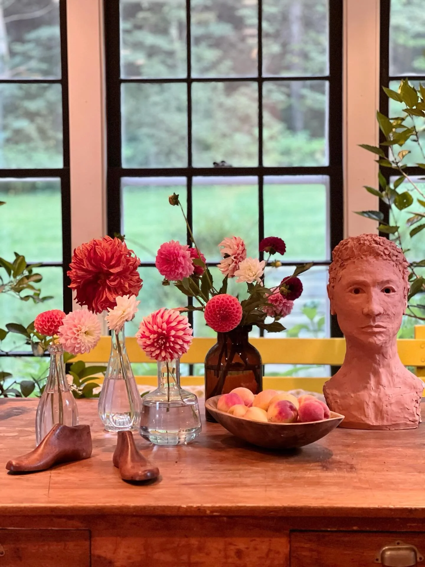I snapped this scene on my kitchen table the day before we left. I imagine now the petals have started dropping and fruit flies are probably buzzing around the peaches. I&rsquo;m always so sad to miss the peak dahlia and peach season at home, and I&r