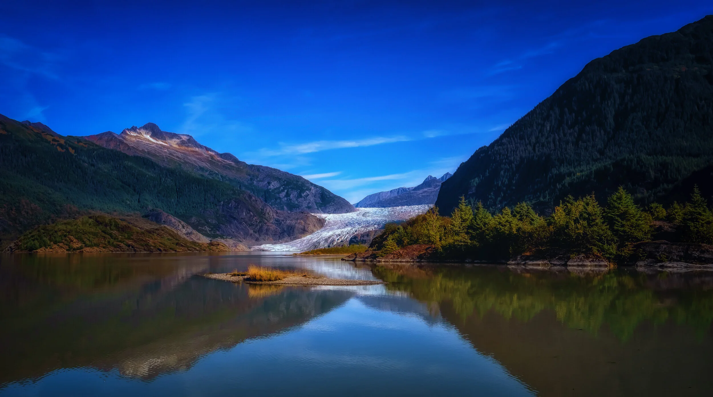 Mendenhall Glacier - Fujifilm X-T3, 1/500 @ f/11, ISO 160, 16mm. A short hike from the Visitor’s Center brings you to this location along Mendenhall Lake. You can see the glacier in the distance. What you don’t see in this image is Nugget Falls just off to the right.