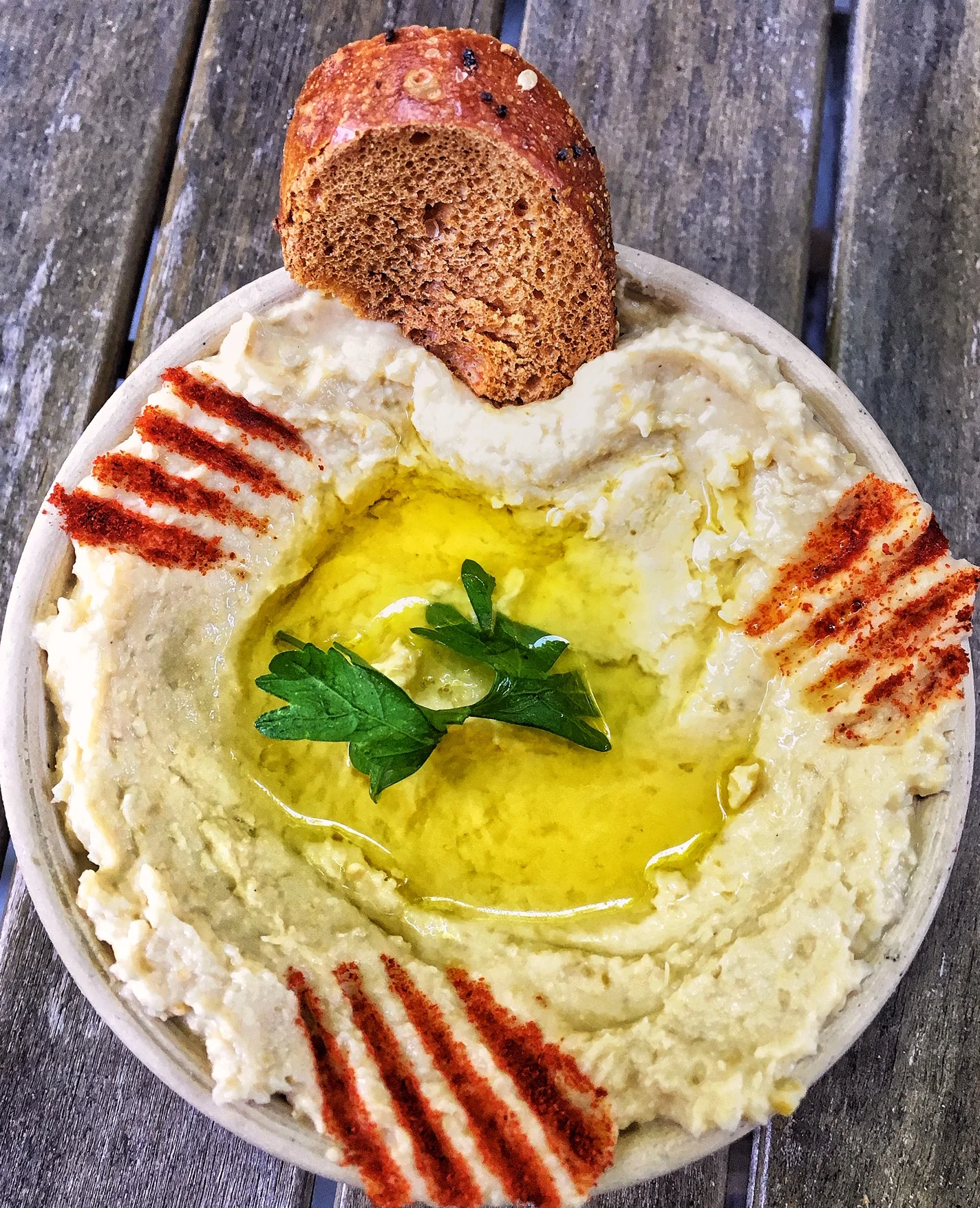 Top with olive oil, fresh parsley, paprika. Hummus goes well with anything pickled, pita, chips, veggies or on sandwiches as a healthy condiment.