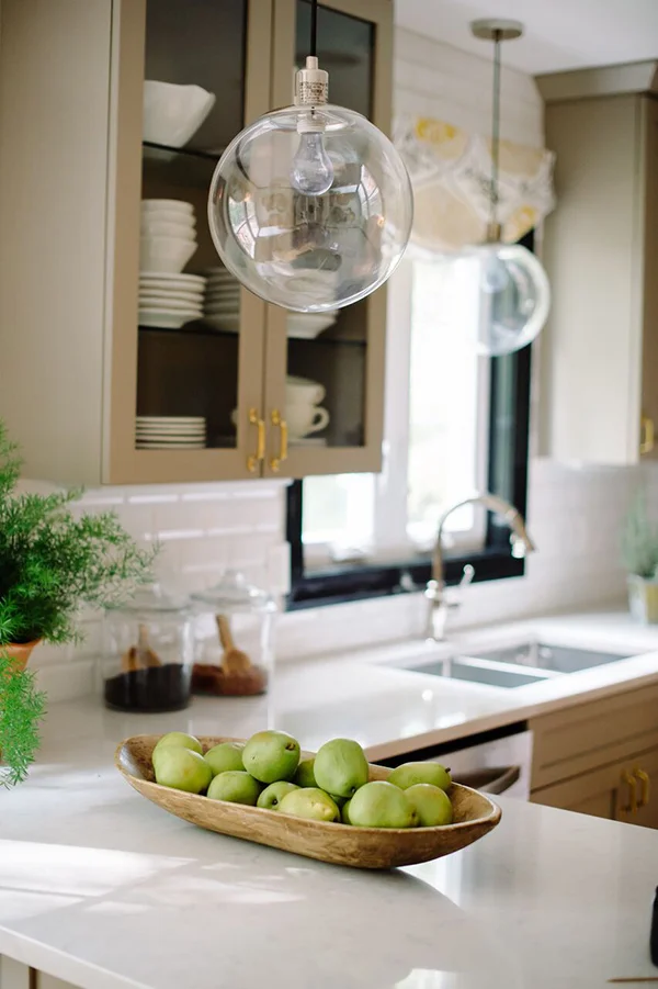 alison-giese-kitchen-white-countertop-styling-gray-cupboard-charlotte-safavi-robert-radifera-e1477074795205.jpg