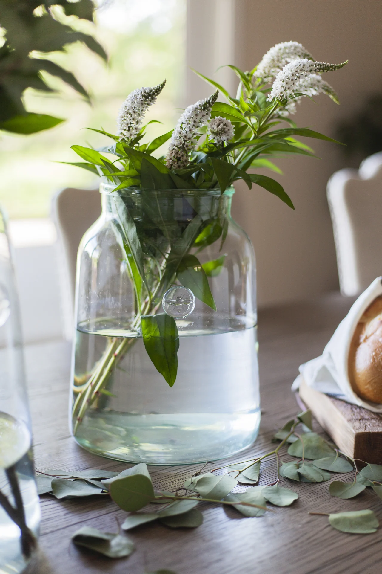 before-and-after-home-reveal-scout-and-nimble-lake-view-luxe-country-interior-design-dining-room-vase-wild-flowers-63.jpg