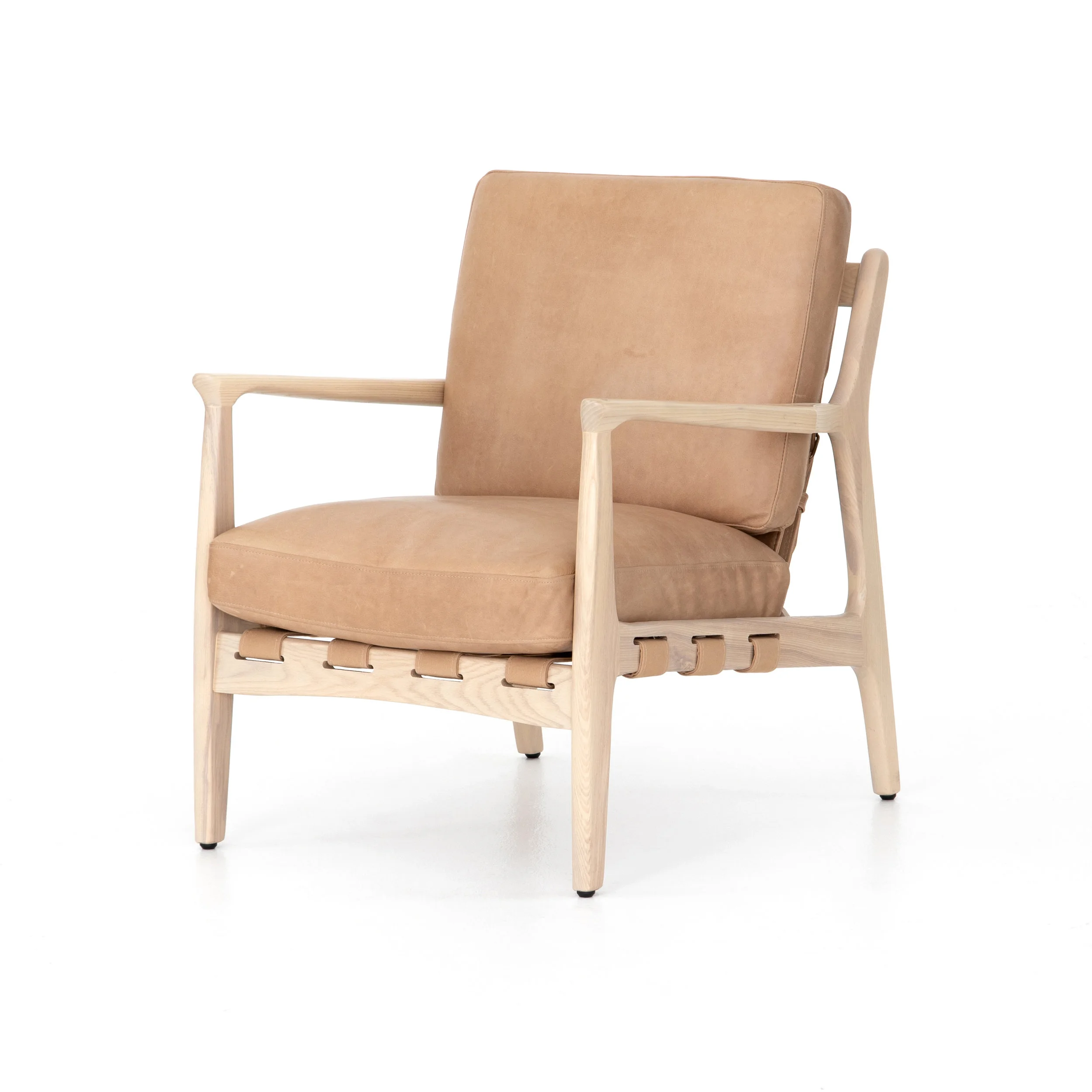 Silas Chair | A striking silhouette with design-forward details any way you look at it. Top-grain, hand-finished leather sits in a whitewashed ash frame fastened by parachute strapping made of canvas, leather and metal buckles.