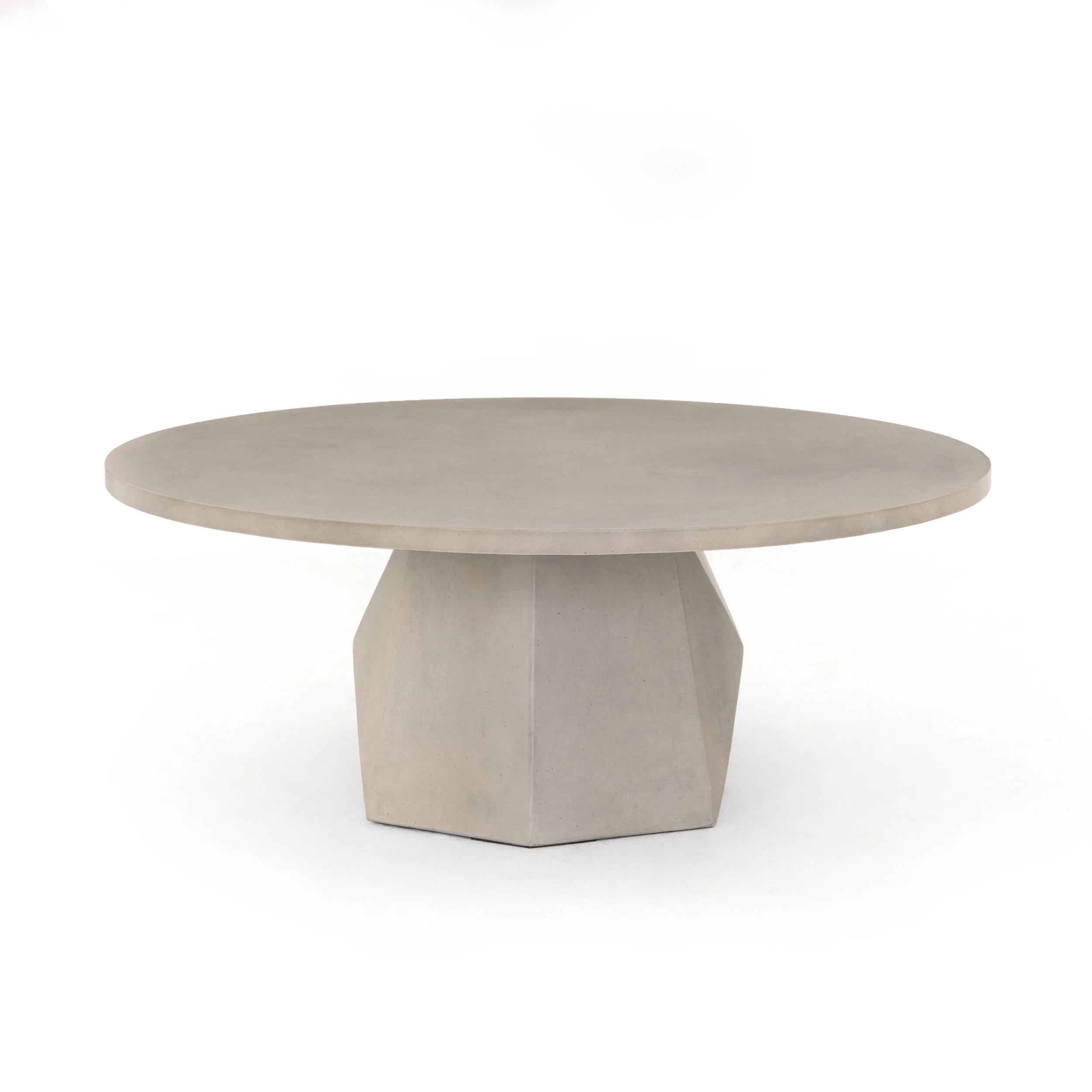 Bowman Outdoor Coffee Table | Grey concrete forms a faceted base for impact from every angle. A roomy, rounded top is ready to welcome guests indoors or out. Cover or store inside during inclement weather and when not in use.