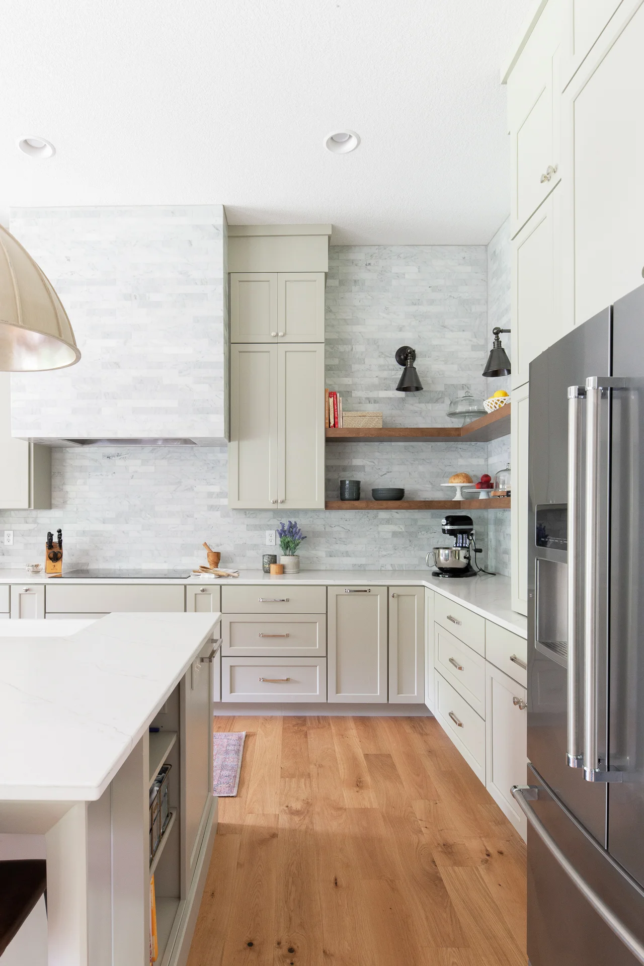 We love they way the Carrara tile extends to the ceiling.