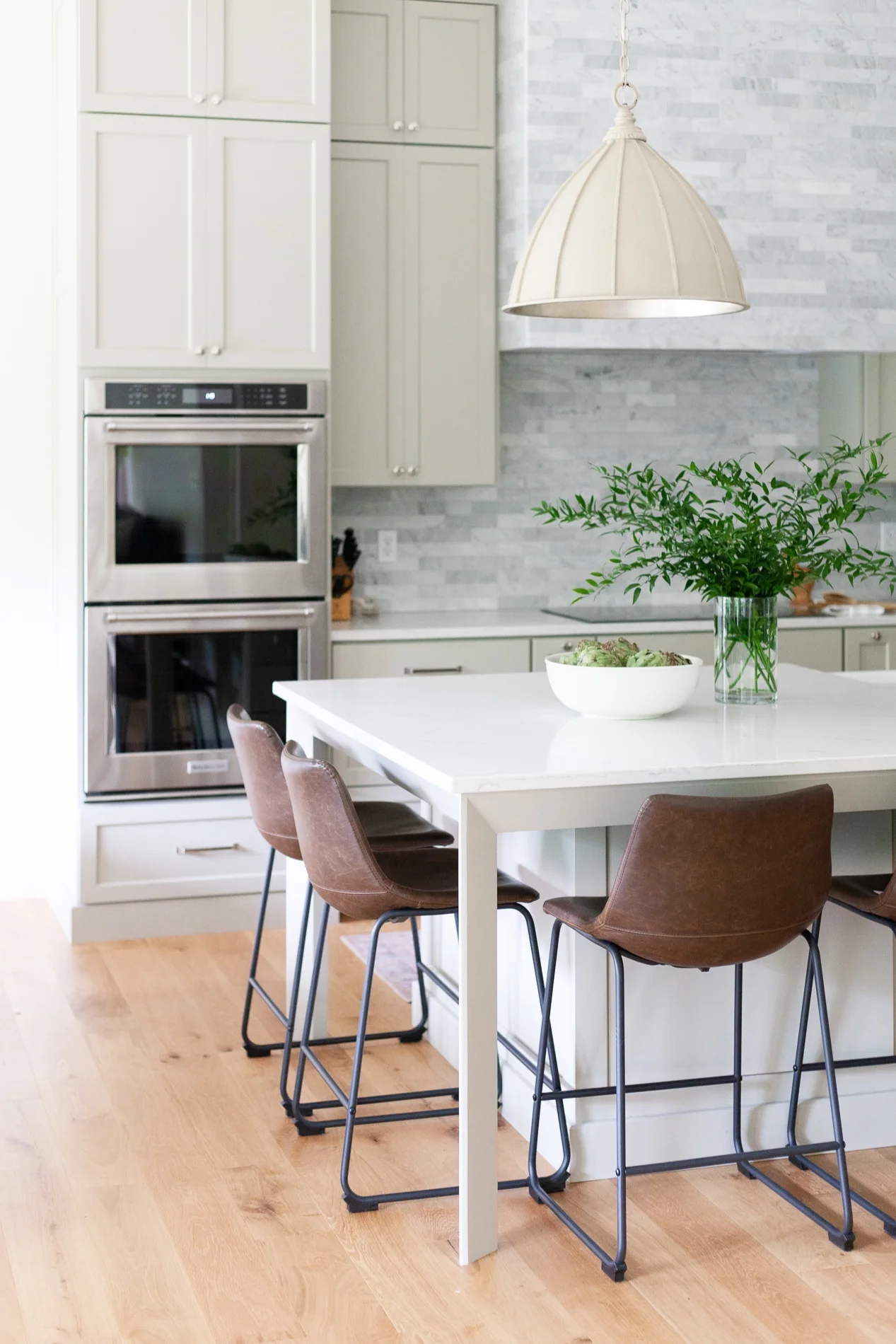 We love how the Fenchurch Pendant looks in this dreamy, neutral kitchen.