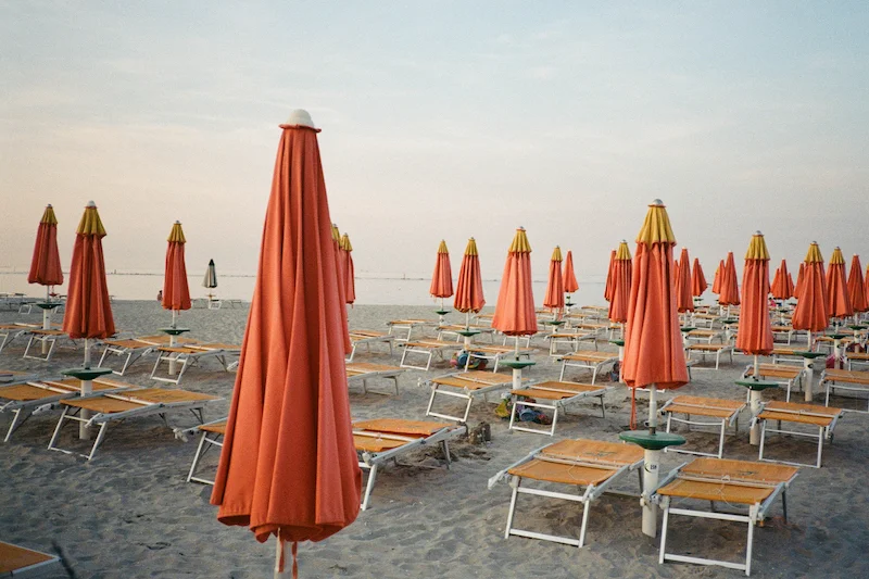 No. 101 ”Marina di Ravenna at Dusk” Art | Shot on film at Marina di Ravenna at dusk, the deserted beach hosts the only remnants of an eventful day on the coast. Founded in the 1930s, the Marina De Ravenna is the oldest beach resort in the region.