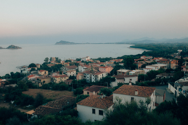 No. 105 ”Marina on the Hill” Art starting at $73.40 | Photographed in Santa Maria Navarrese, Sardinia, this image captures a small Italian village and marina at dusk. Santa Maria Navarrese is a growing tourist destination on the eastern side of Sardinia.