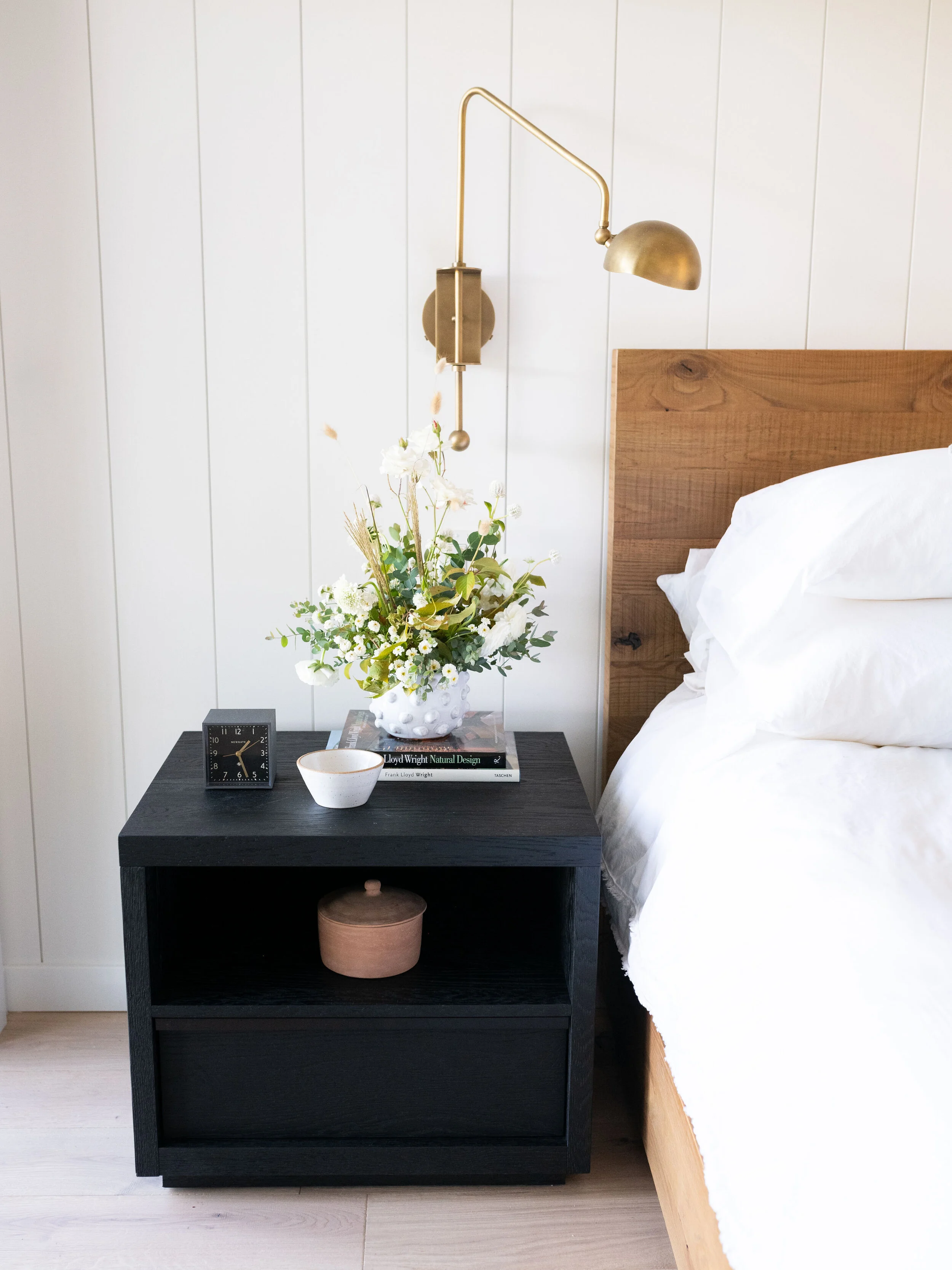 Beautiful brass accents are carried throughout the home but we particularly love this swing sconce.