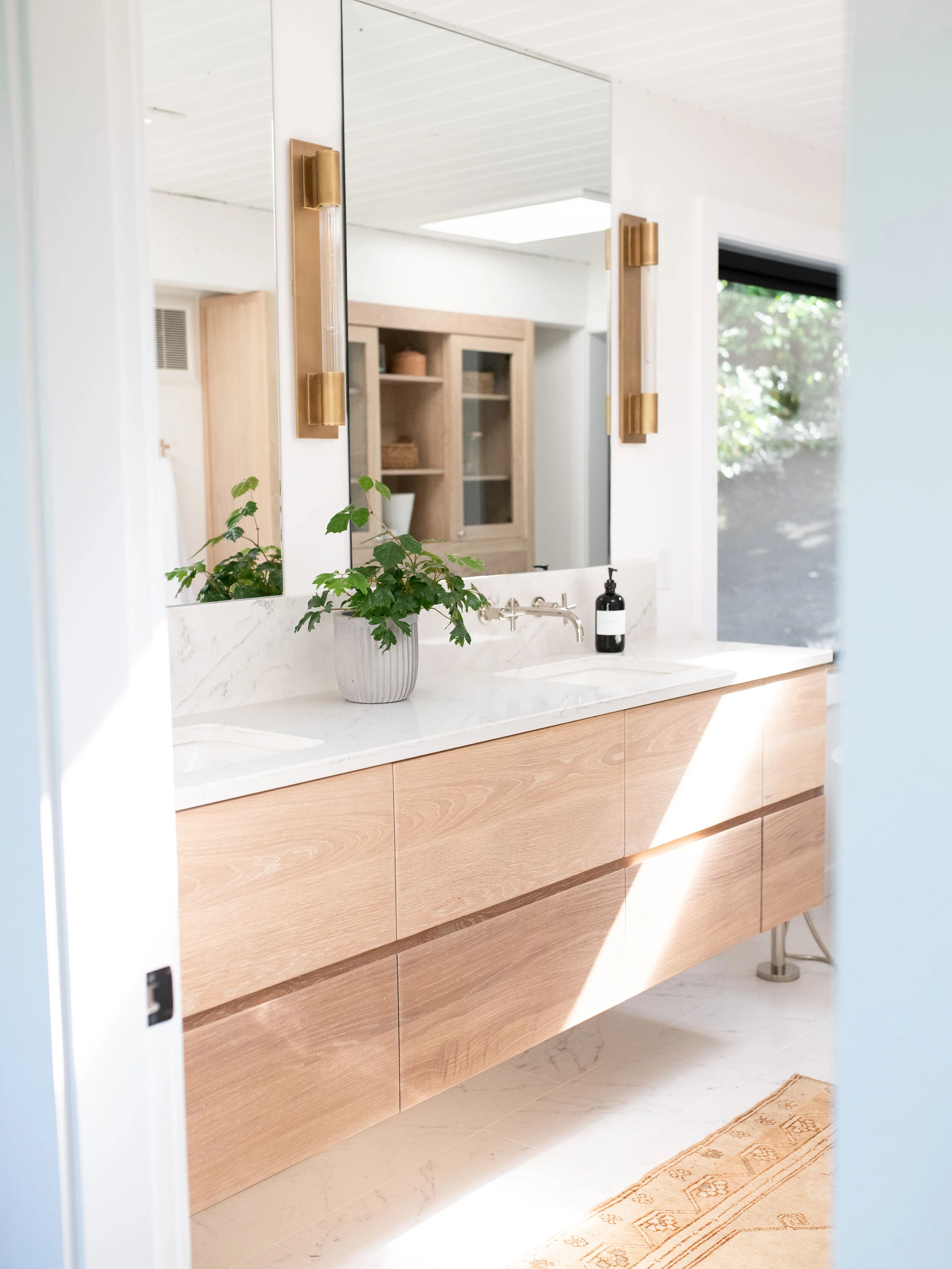 Let there be natural light! The skylight—visible in the mirror—is an unexpected but beautiful addition to this master bath