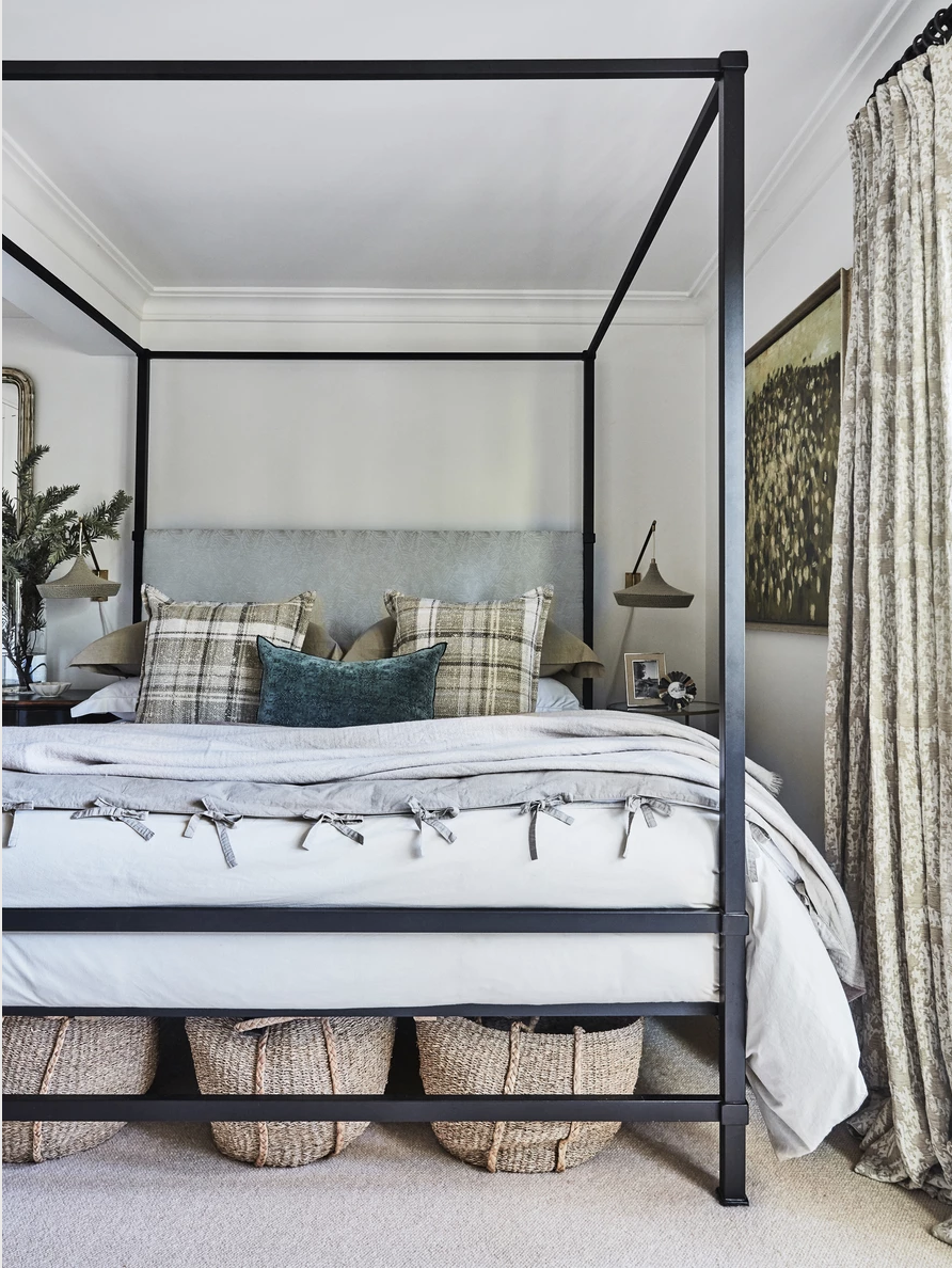 Baskets hidden beneath the bed provide extra space for storage.
