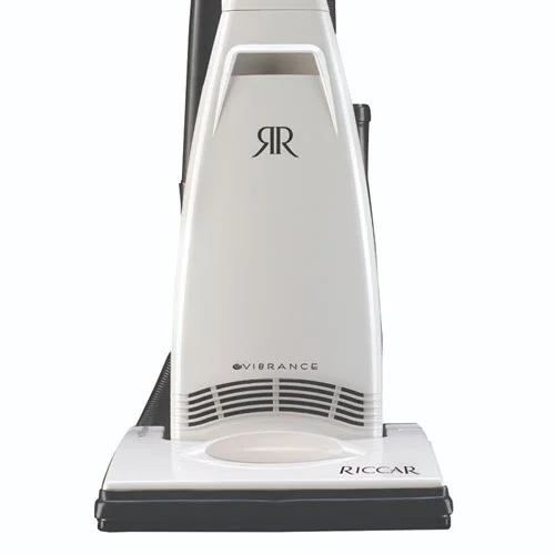 Riccar Vibrance Classic Entry (R20E) - $329.95 • Carpet and Rug Institute – Gold Seal of Approval • Assembled in the United States of America • Onboard FastTask Tools • 10 Amp Motor • 616 Air Watts at Hose • Foam Filters, Available HEPA Bag • ABS Handle, Bottom Plate, & Wheels • Wood Brushroll & Rubber Belt • 30’ Cord • No Headlight, Switch on Body • 22.5 lbs. • 3 Year Warranty