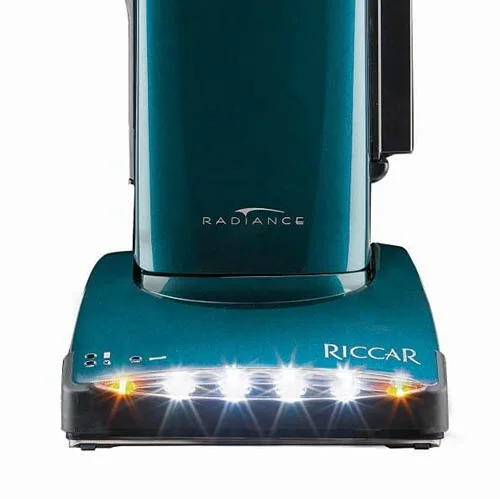 Riccar Radiance Premium (R40P) - $1249.95 • Carpet and Rug Institute – Gold Seal of Approval • Assembled in the United States of America • Onboard FastTask Tools With 17’ Stretch Hose • 12 Amp Combined Motors • Patented Tandem Air Cleaning System • HEPA Filter, Granulated Charcoal Filter for Odors, HEPA Bag • Metal Handle, Bottom Plate, & Rubber/Brass Wheels • Metal Brushroll, Carpet/Floor Selector on Handle & Lifetime Belt • Amber Colored Dirt Finder Lights • 40’ Cord, Quad LED Headlights, Switch on Handle • 22.5 lbs. • 8 Year Warranty - 3 Free Red Carpet Services