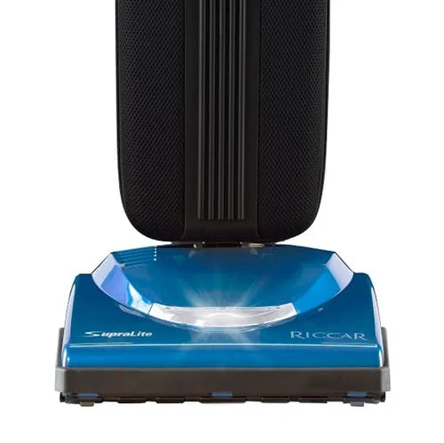 Riccar Supralite Cordless (R10CV) - $699.95 • Carpet and Rug Institute – Bronze Seal of Approval • Assembled in the United States of America • 312 Watt Motor, 44V Lithium Ion Battery Pack • Switch on Handle • HEPA Bag, 24” Long • Metal Handle With Ergonomic Grip • Metal Brushroll, Bare Floor Squeegee, Rubber Wheels • Up To 50 Minutes Runtime • LED Headlight, Rubber Belt • 11 lbs. • 4 Year Warranty, 2 Years Free Servicing