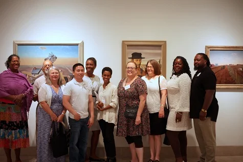 DMA Friends members with DMA Friends Community Manager (center left) and Rae Pleasant (center) on exclusive curatorial tour.