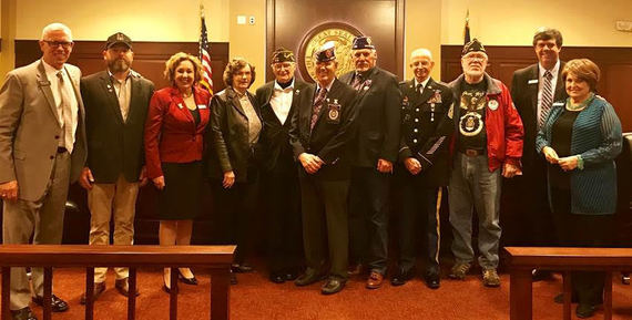 Members of the Senate, House, and supporters of HR89. From left to right. Representative Scott Syme, Dan Nelson, Senator Abby Lee, Ms. Gayle, Al Cole, Ned Barker, Bill Hamilton, Phil Hawkins, Doug Foote, Senator Jim Rice, and Senator Pattie Anne Lodge.